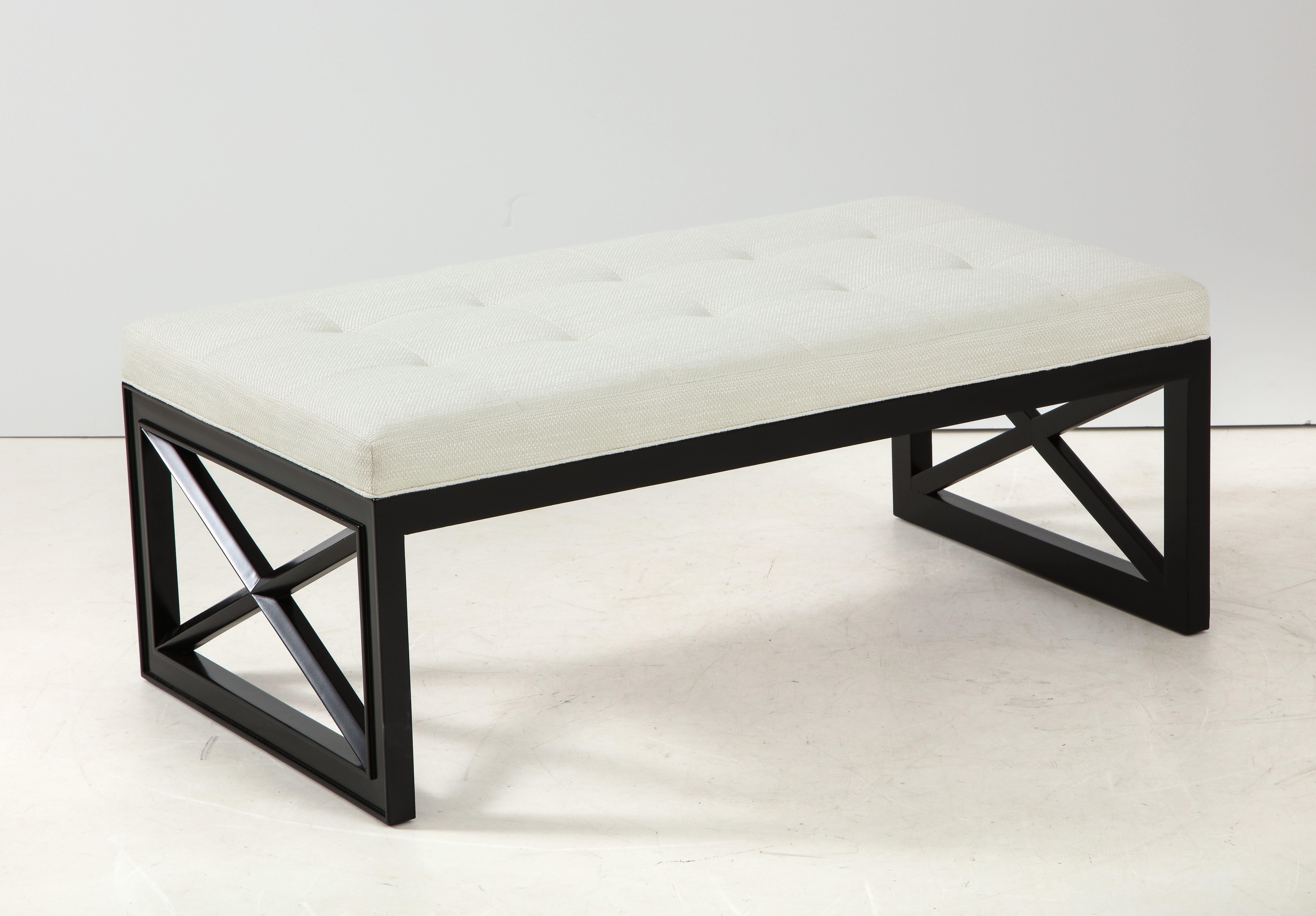 Black lattice frame bench by James Mont.
The bench has been newly refinished and reupholstered in an ivory
colored fabric with biscuit tufted detail.