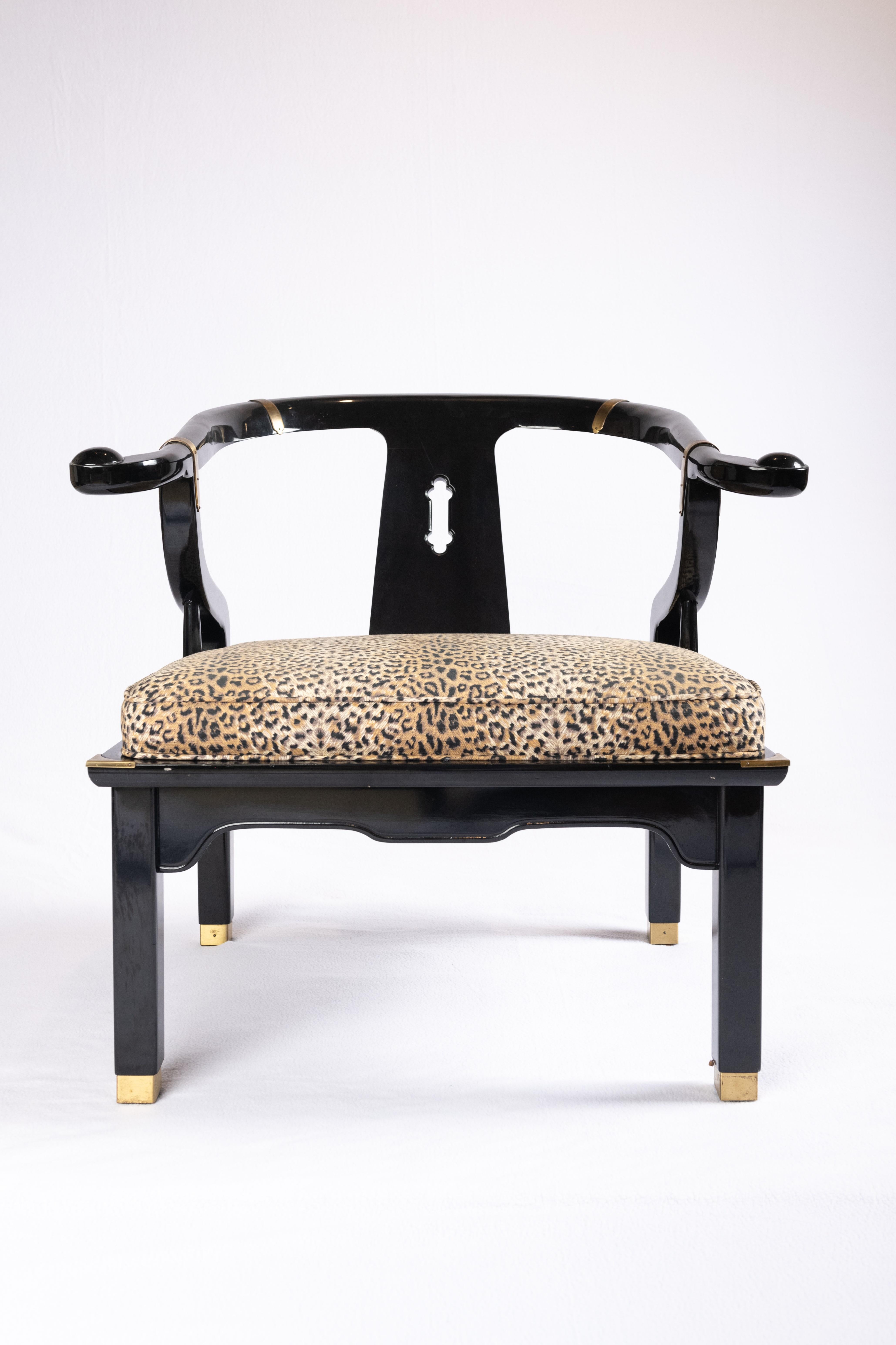 Ming style yoke back black lacquered low chair in the style of James Mont. circa, midcentury-1970s. Upholstered in animal print fabric. 

Four available, priced and sold in sets of two 

These collectible chairs have a wide square seat base with