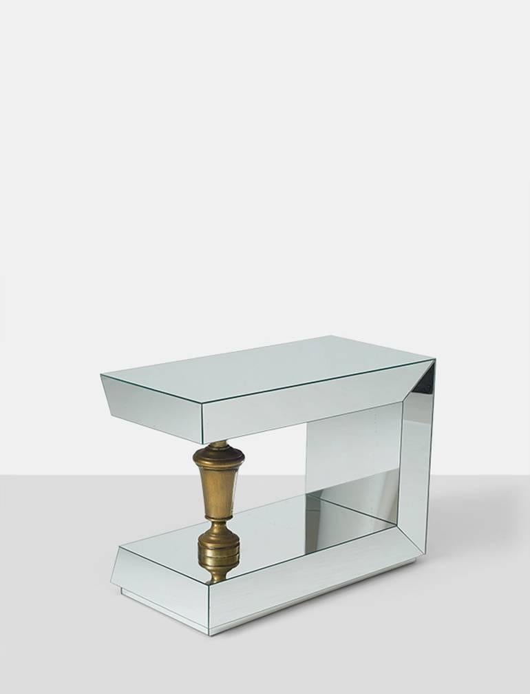 A pair of end tables by James Mont. Fully mirrored with a brass urn shaped support.