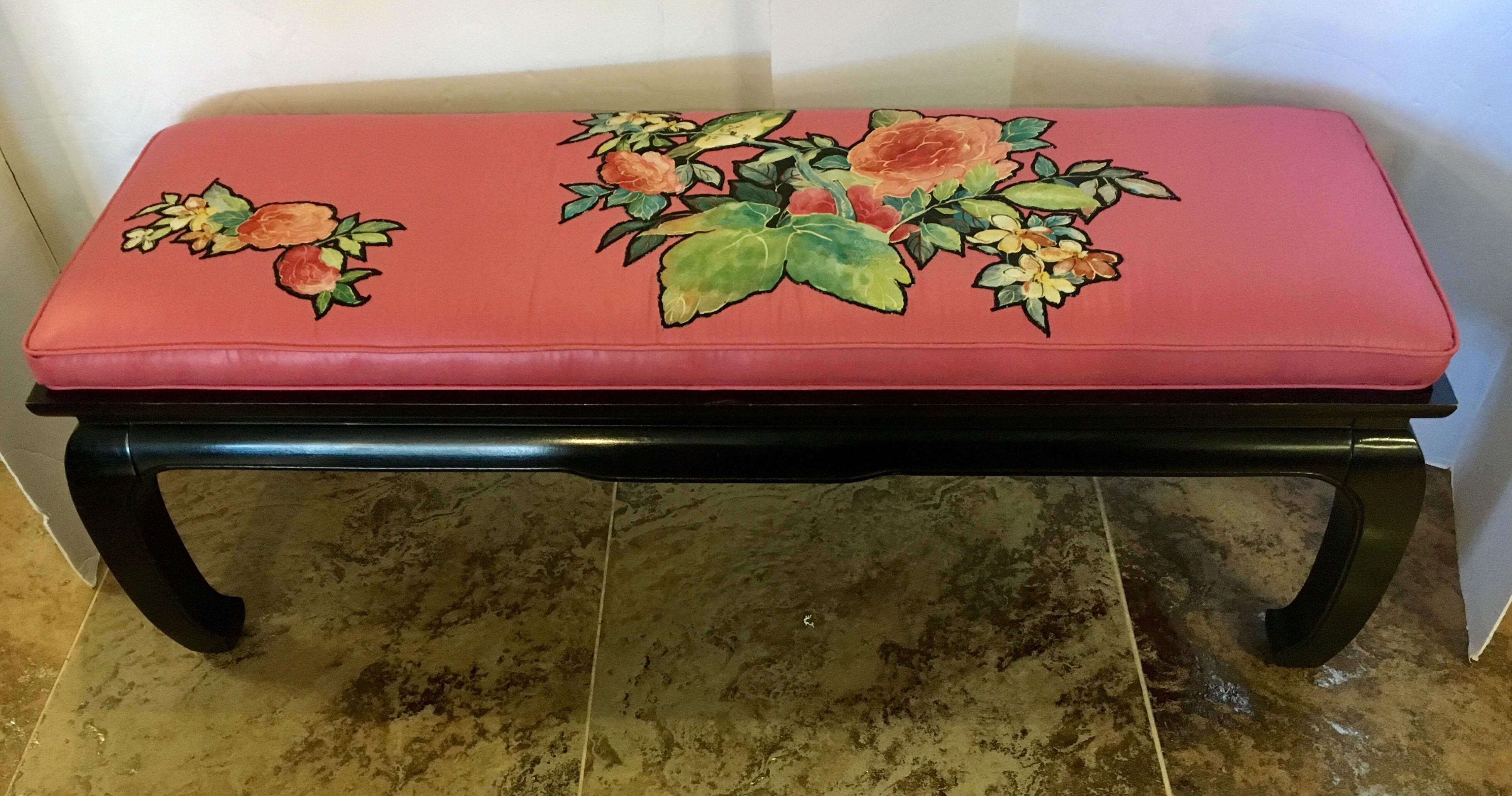 James Mont style Asian bench with a pink silk upholstered seat and floral appliqué.