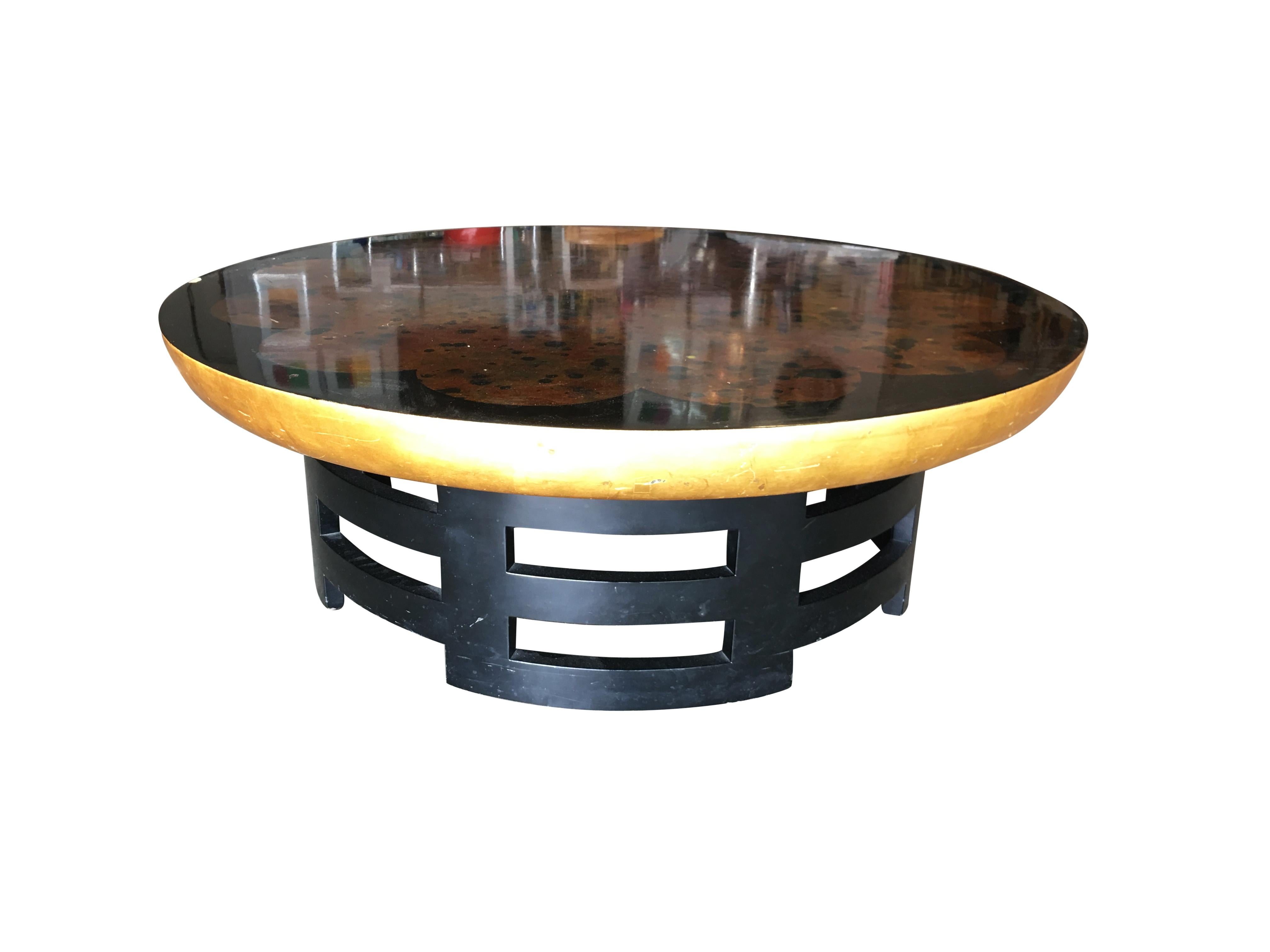 Asian inspired coffee table with black sculpted base and black lacquer top by Muller and Barringer for Kittinger in the 1950's.