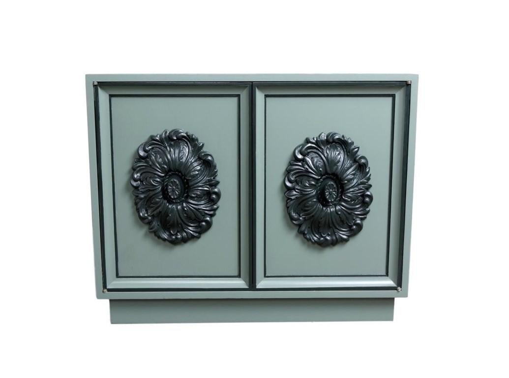 Absolutely stunning and exuberant 1960's James Mont style small sideboard, dry bar cabinet or credenza is sure to turn heads featuring distinctive original large medallions on both door fronts reminiscent of similar Hollywood Regency medallions