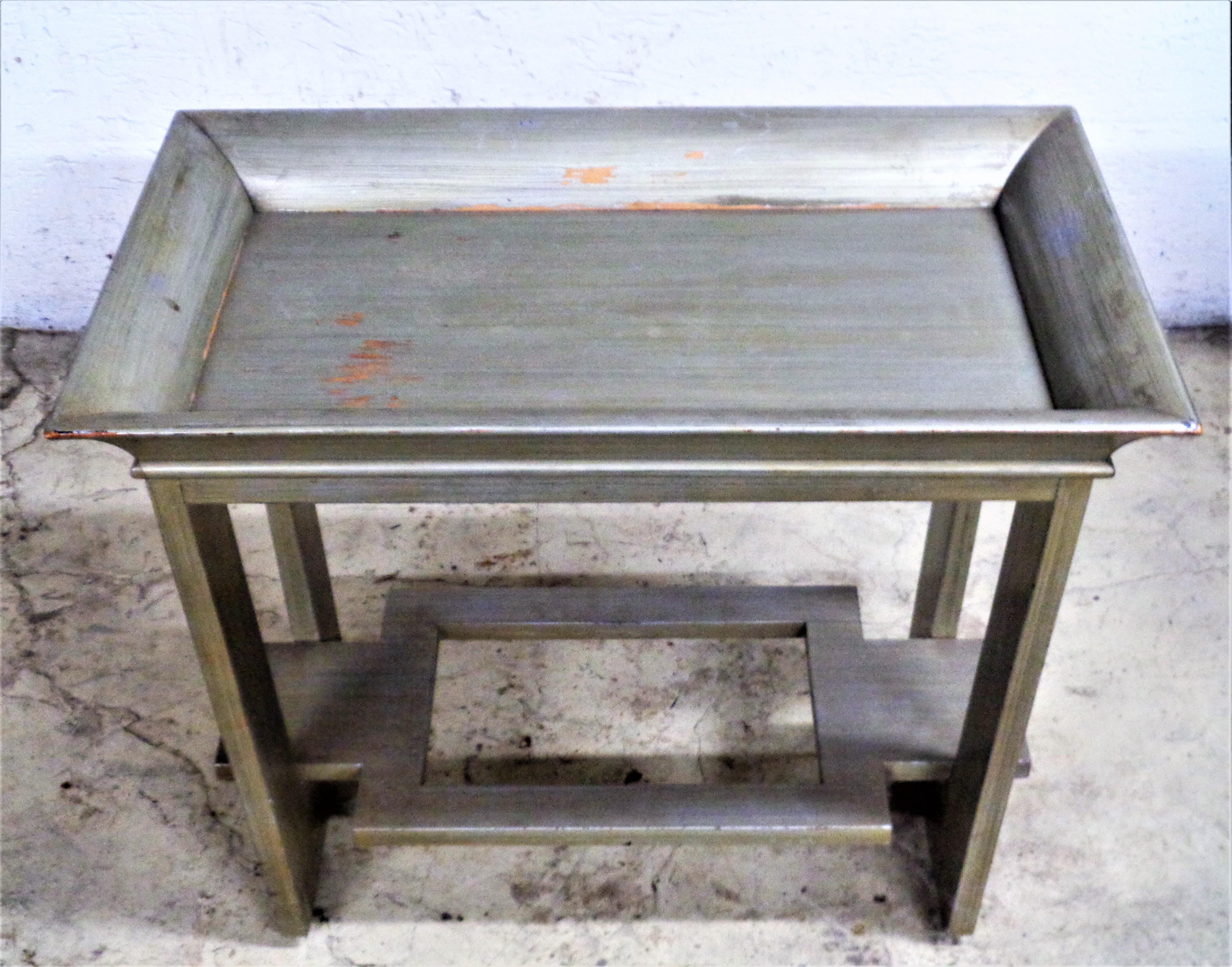 Wood tray table with removable tray top in overall nicely aged original silver leaf finish. In the Asian modern style of James Mont, circa 1940's. Look at all pictures and read condition report in comment section.