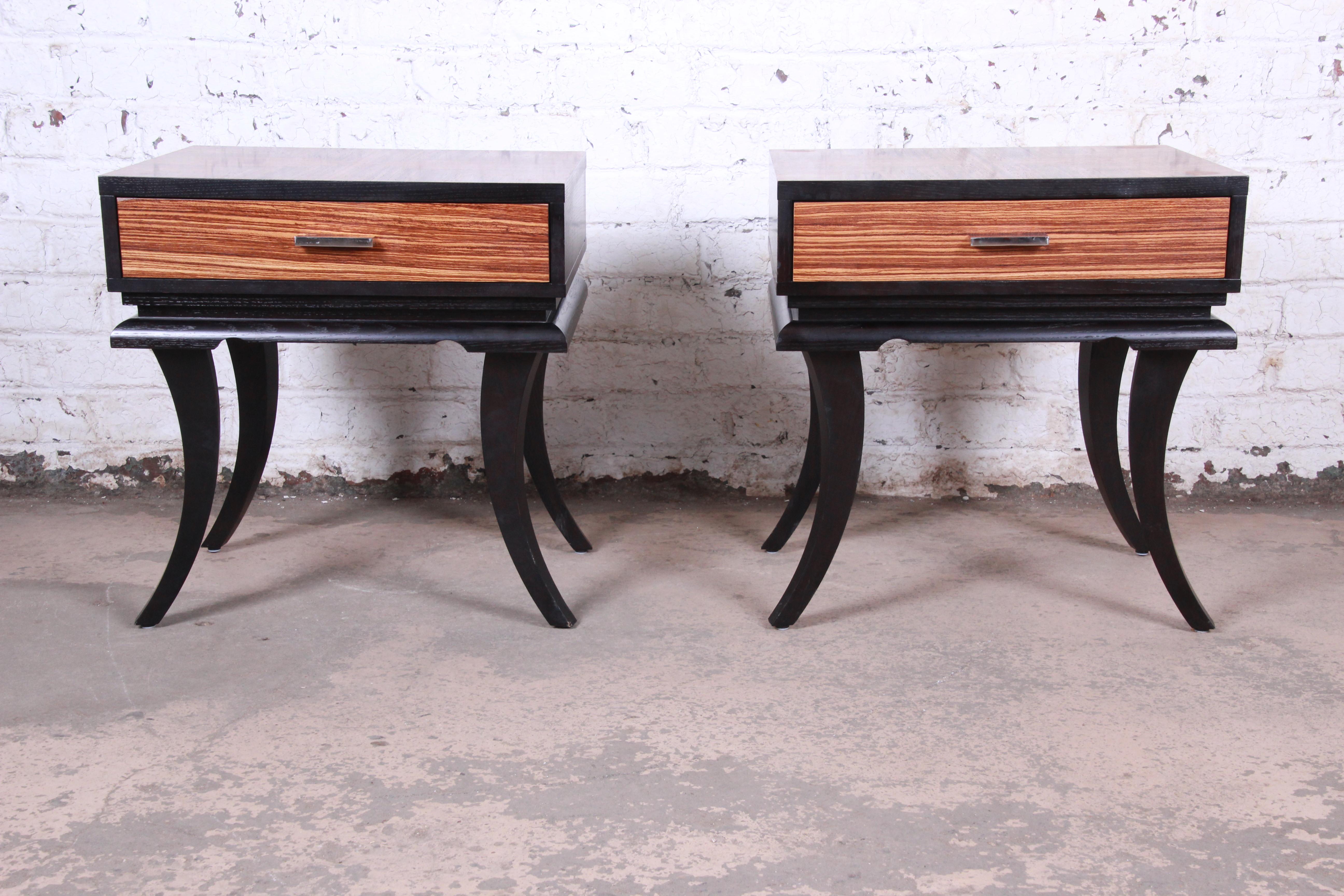 Mid-Century Modern Pair of James Mont Style Zebrawood and Ebonized Saber Leg Nightstands