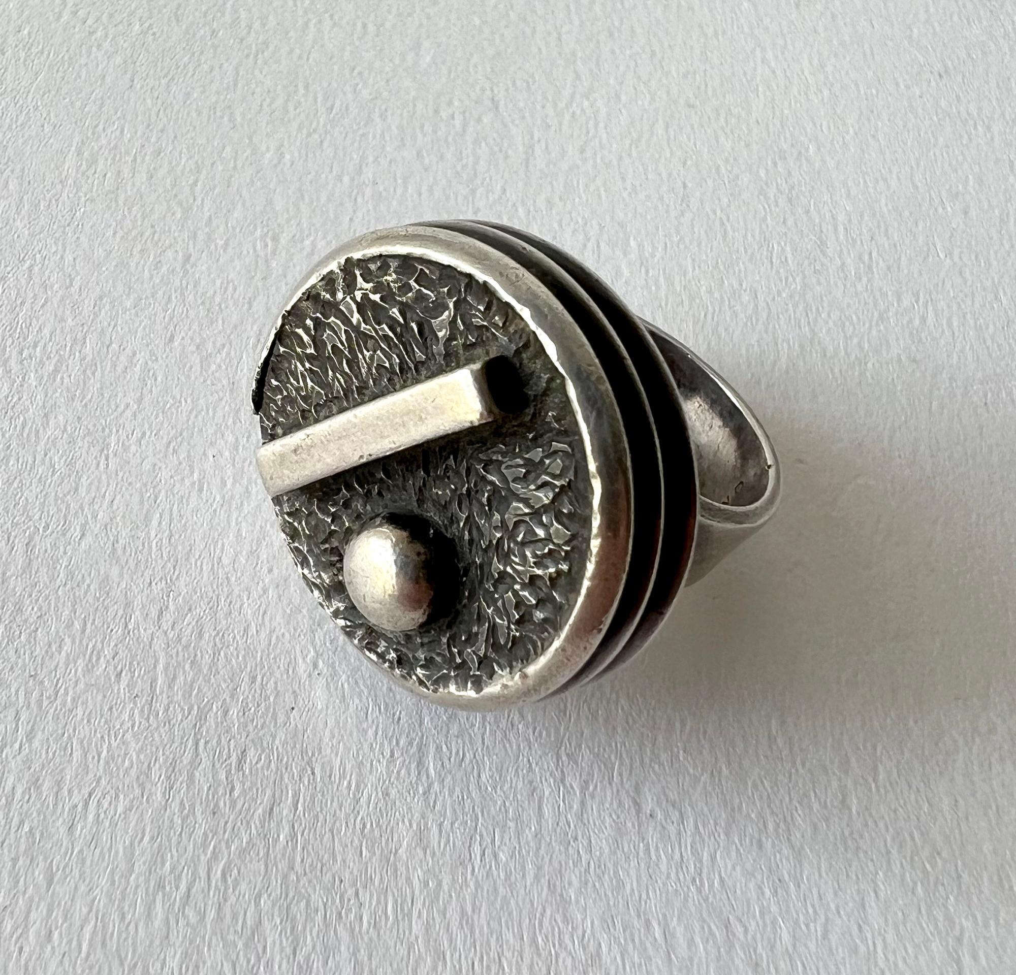 Sterling silver geometric modern ring created by San Diego studio jeweler, James Parker.  Ring is a finger size 7 and is signed with the conjoined JP hallmark, Hand Made.  Suitable for a man or woman and in very good vintage condition and from never