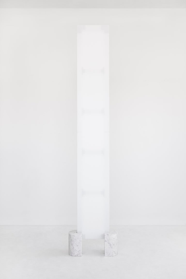 This white and marble minimal sculpture titled 