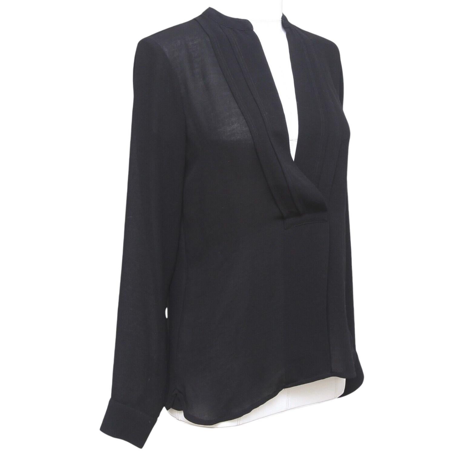 GUARANTEED AUTHENTIC JAMES PERSE BLACK V-NECK LONG SLEEVE BLOUSE

Design:
  - Comfortable to wear black deep v-neck blouse.
  - Collarless.
  - Long sleeve, button at each cuff.
  - Front lower center pleat.
  - Slip on.
  - Beautiful, lightweight