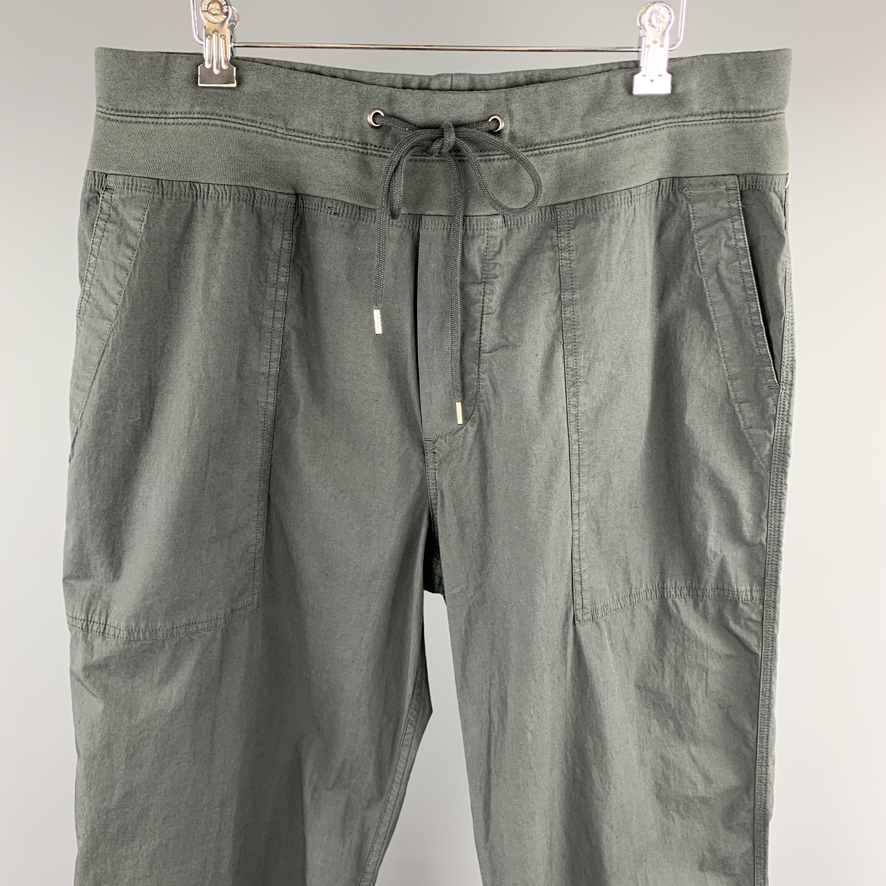JAMES PERSE jogger style pants come in light weight cotton poplin with outer seam pockets and jersey drawstring waistband. 

New With Tags.
Marked: 2

Measurements:

Waist: 35 in.
Rise: 14 in.
Inseam: 29 in.