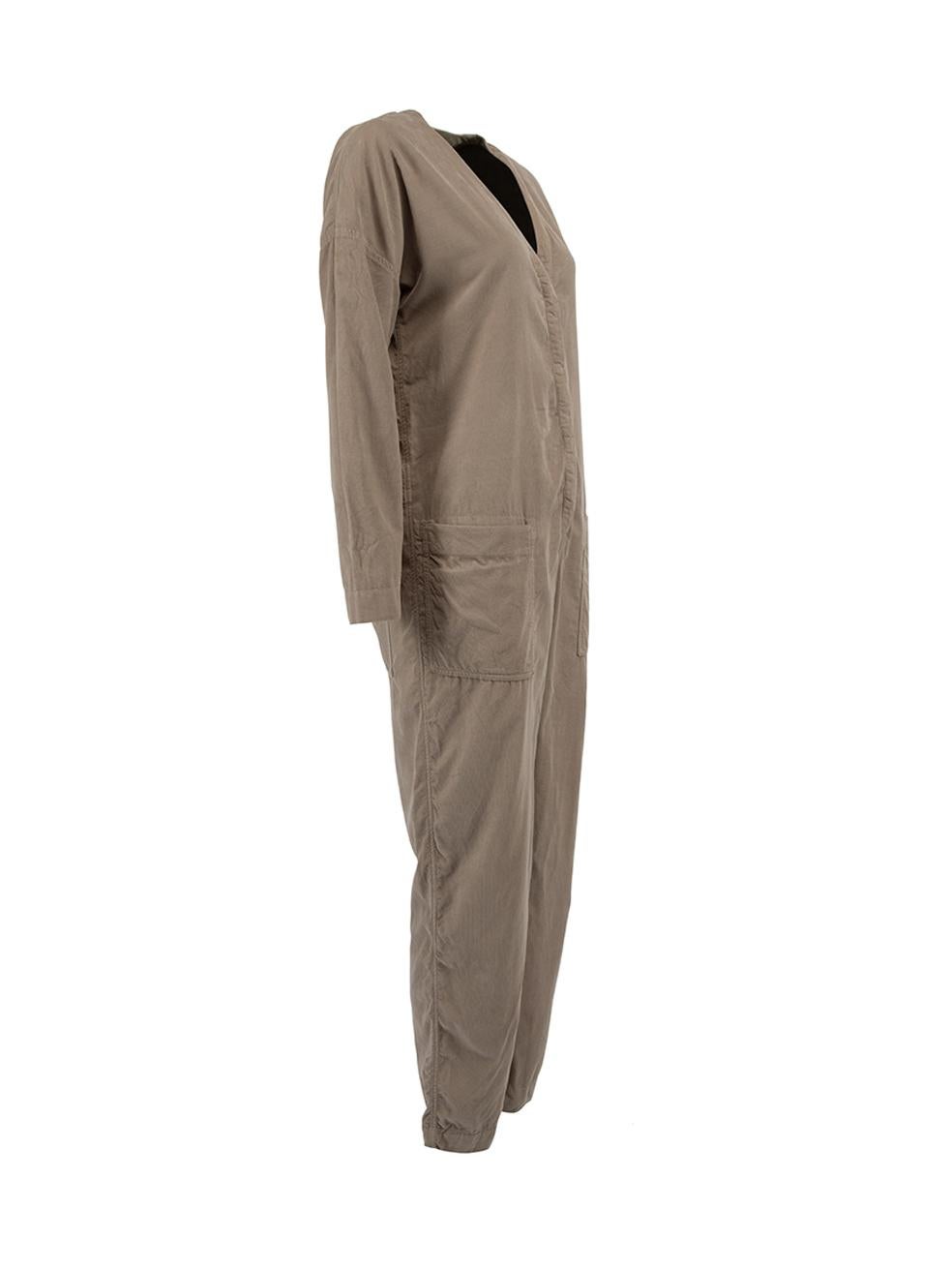 CONDITION is Very good. Hardly any visible wear to jumpsuit is evident. Very minor loose threads around jumpsuit is seen on this used James Perse designer resale item.  Details  Grey Corduroy Long sleeve jumpsuit V neckline Front button closure