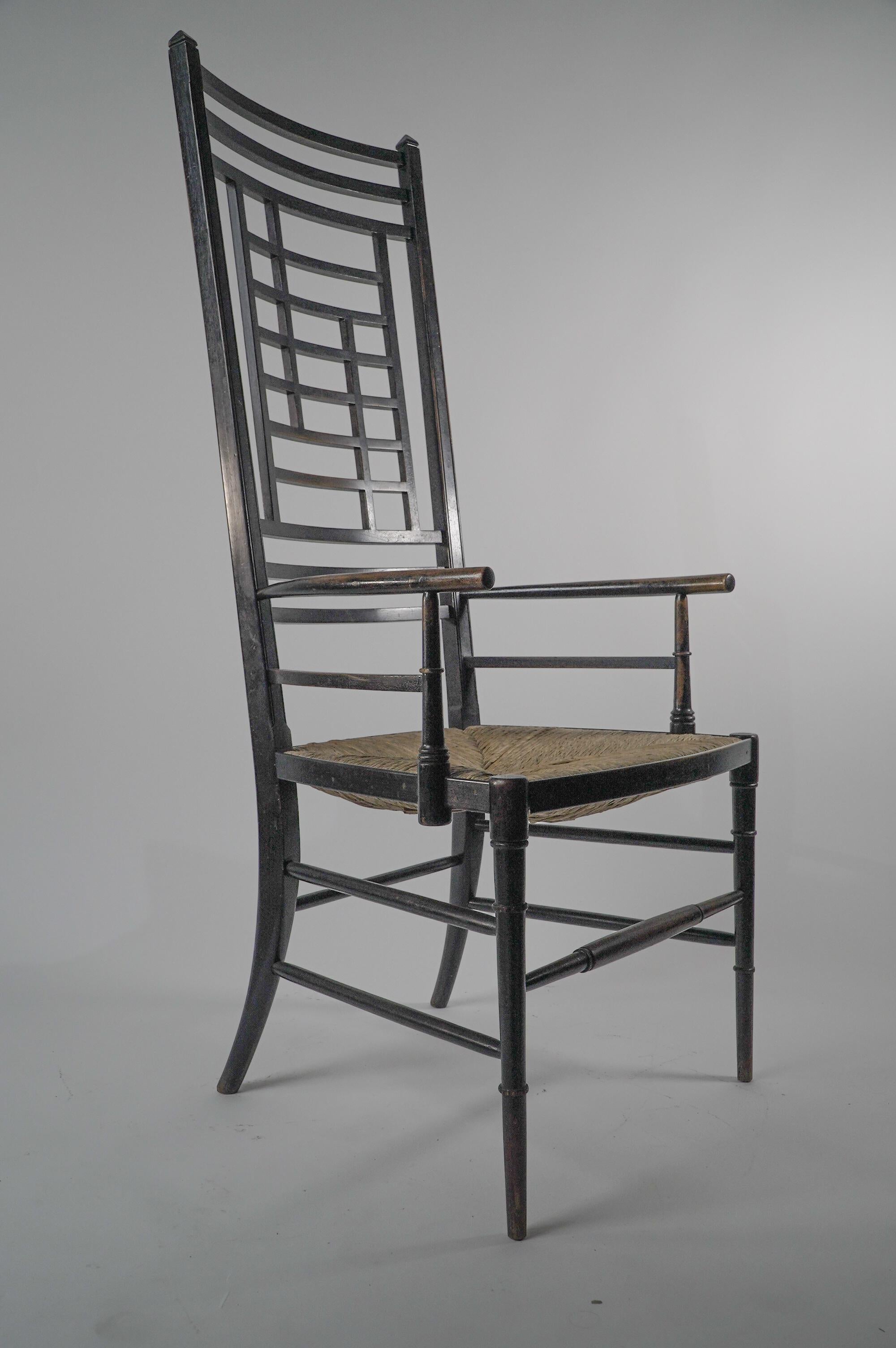 English James Plucknett attri. an exagerated high back AngloJapanese ebonized armchair For Sale