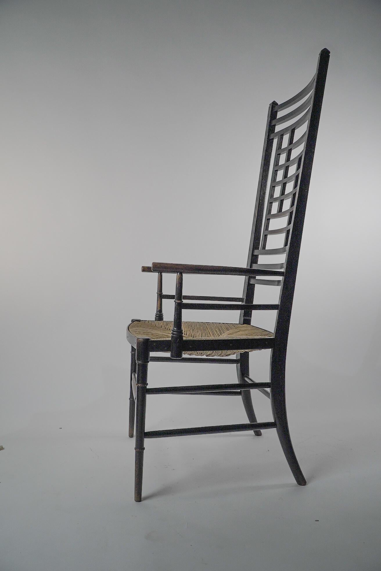 Late 19th Century James Plucknett attri. an exagerated high back AngloJapanese ebonized armchair For Sale