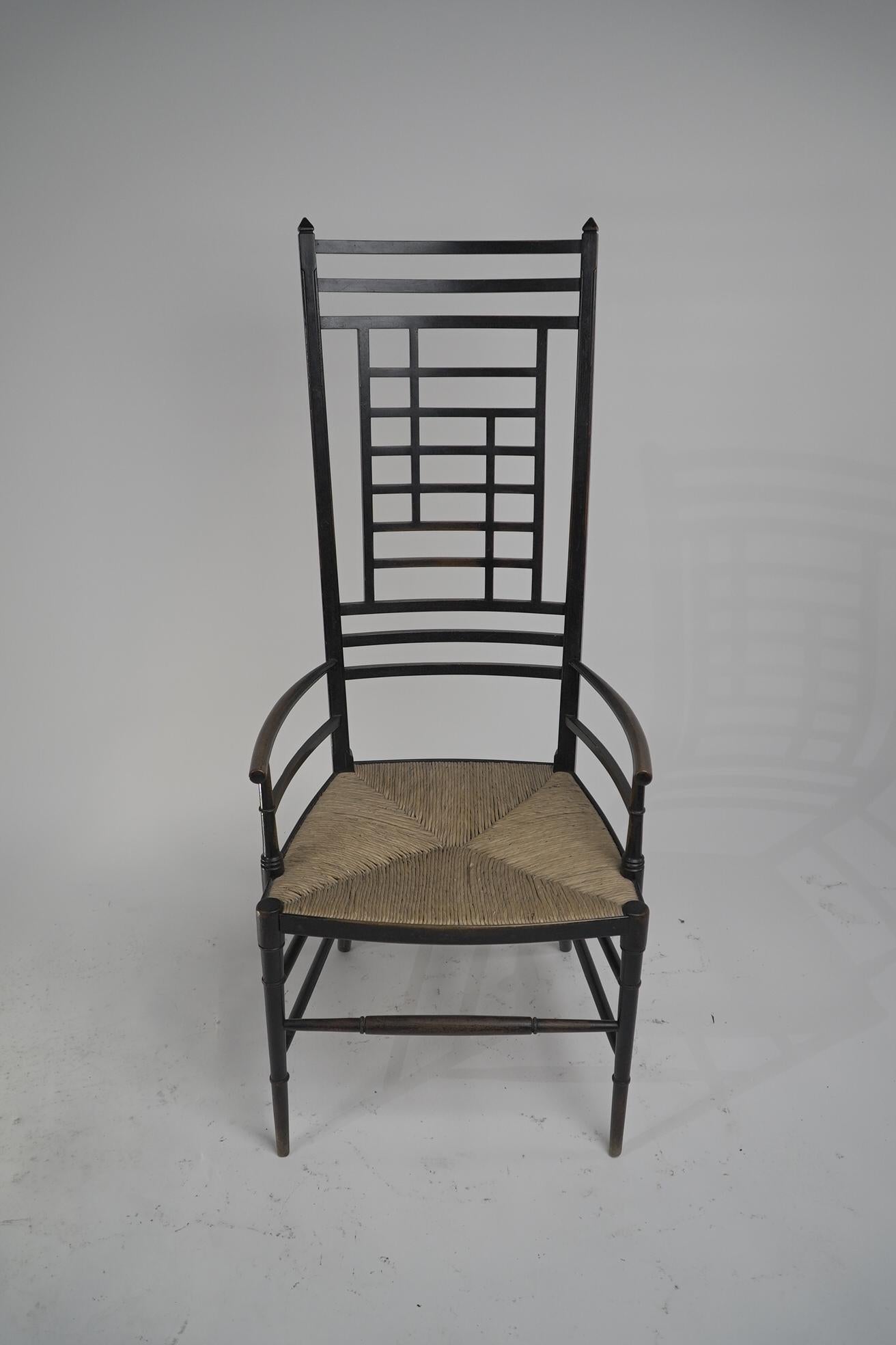 James Plucknett attri. ein anglo-japanischer ebonisierter Sessel mit abgenutzter hoher Rückenlehne (Anglo-japanisch) im Angebot