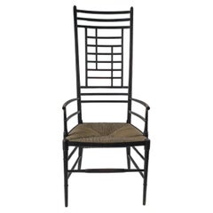 James Plucknett attri. un'esagerata poltrona anglo-giapponese con schienale alto ed ebanizzata