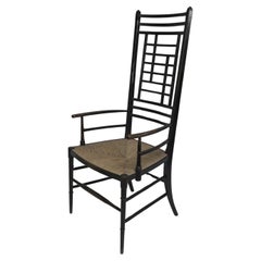 James Plucknett attri. un exagerado sillón anglojaponés ebonizado de respaldo alto