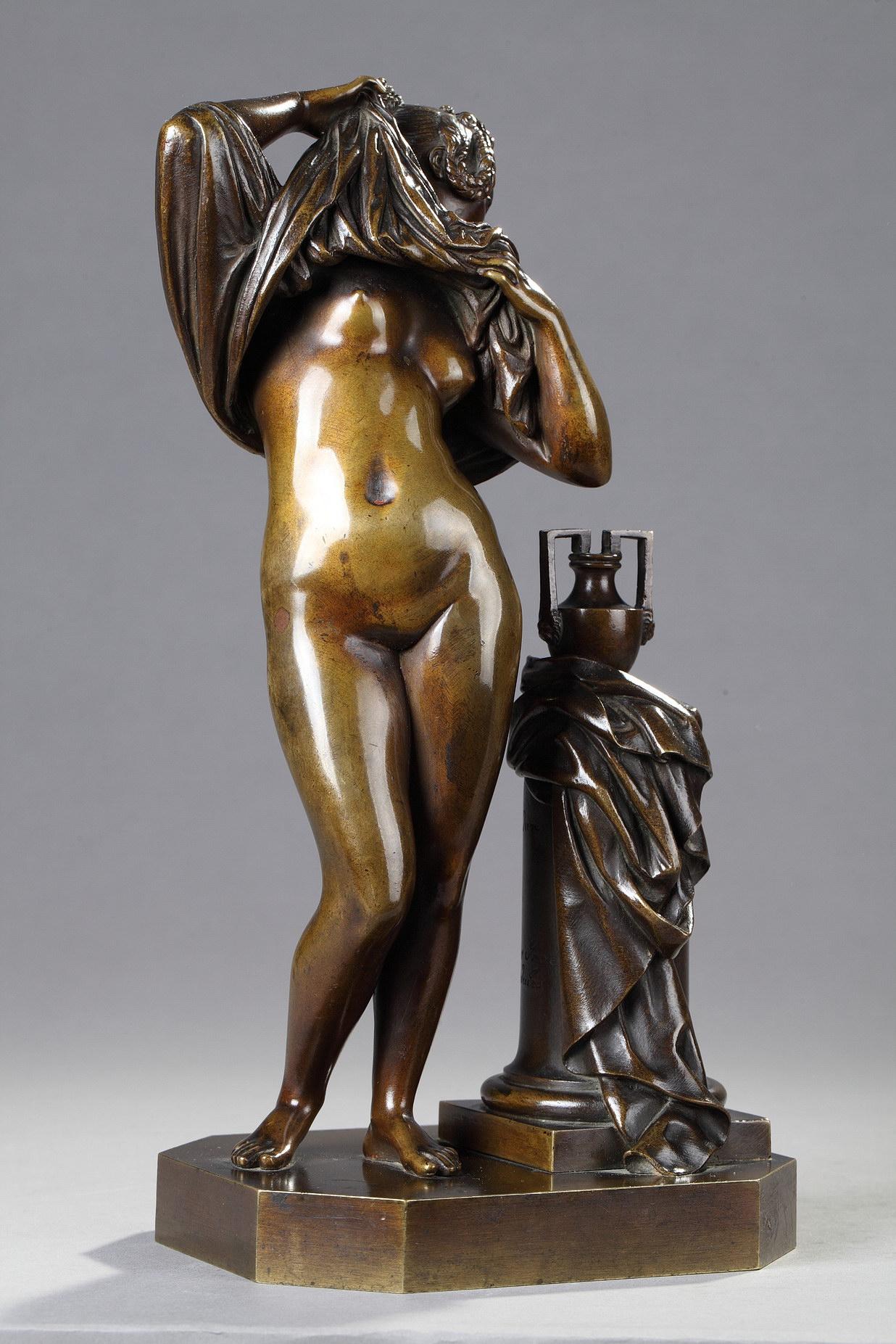 Woman taking off her shirt - French School Sculpture by James Pradier