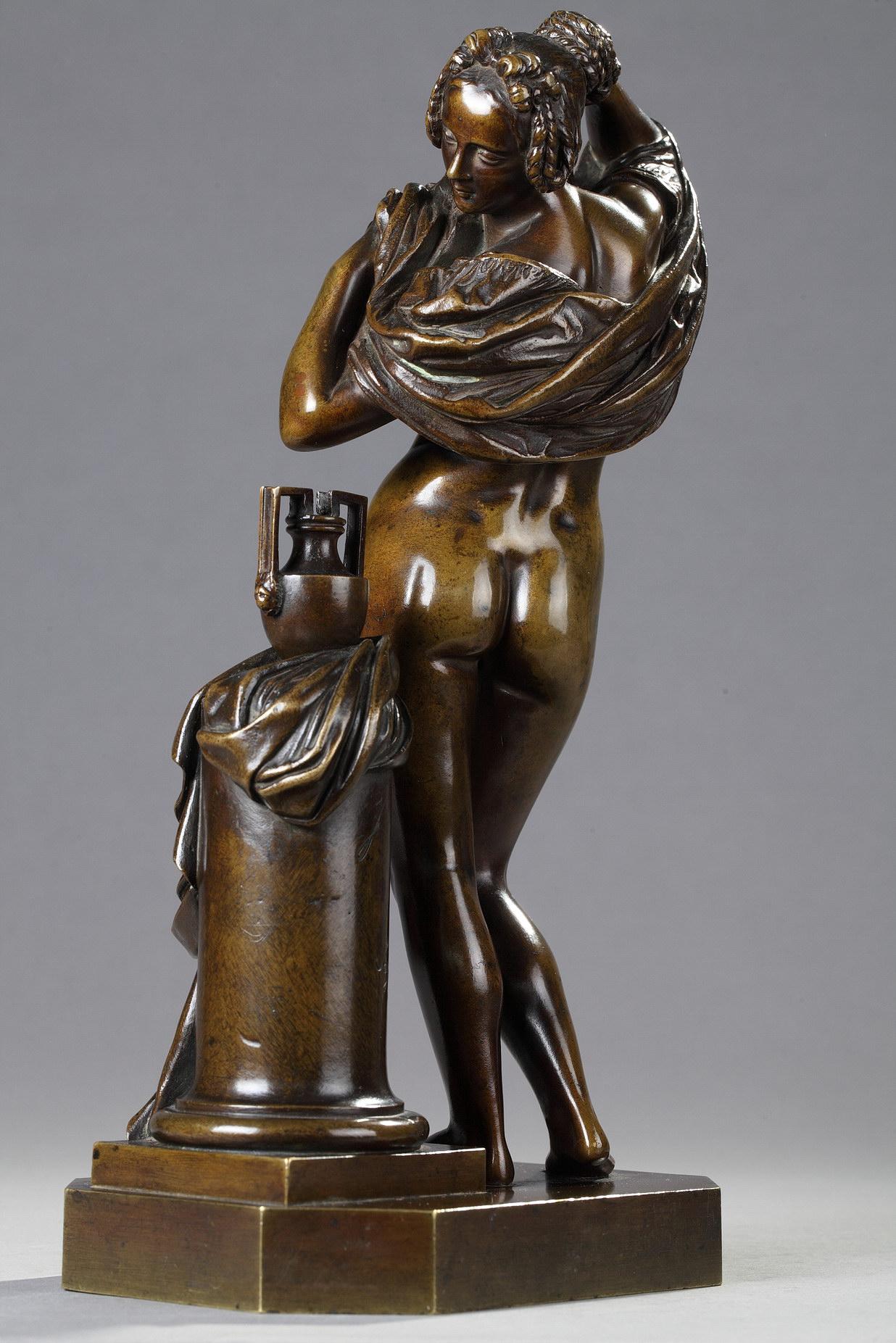 Woman taking off her shirt - Gold Figurative Sculpture by James Pradier