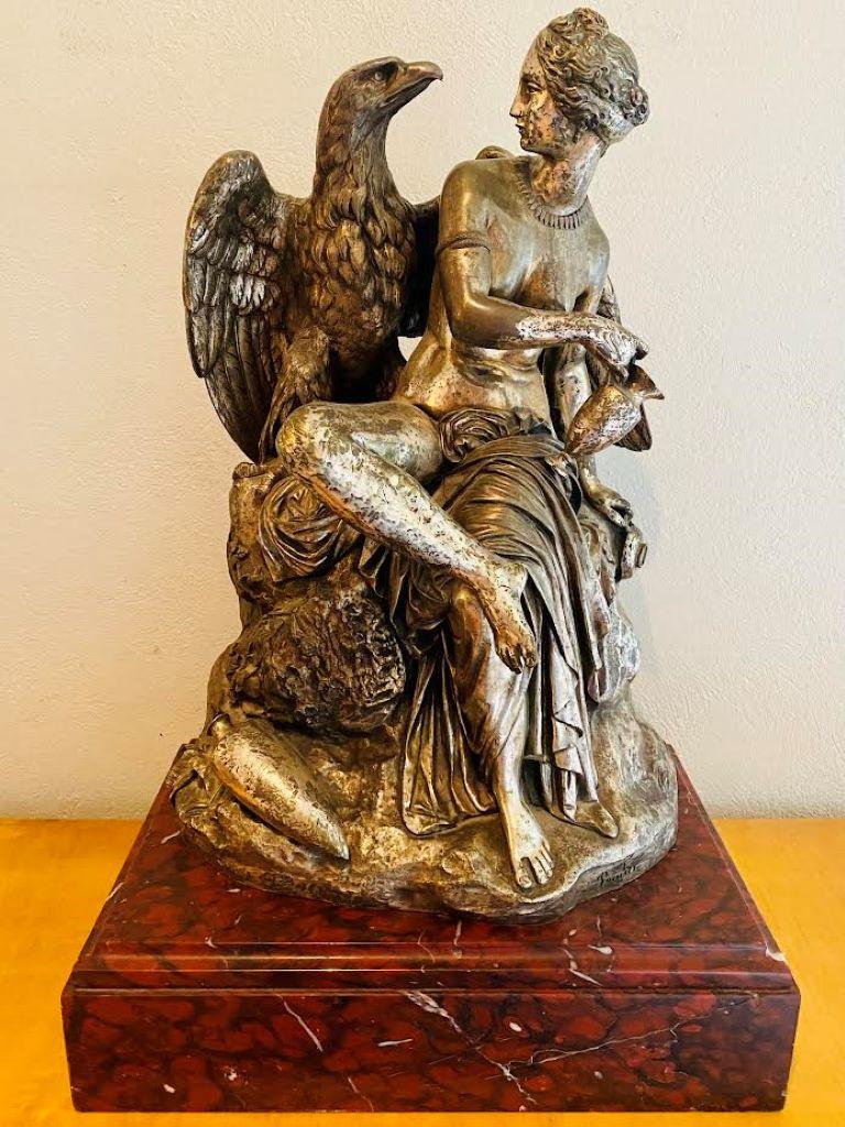 Hébé et Jupiter par James Pradier (1790-1852)
Grand sculpture neoclassique en bronze argenté sur socle de marbre rouge
Signé Pradier en bas à droite
Marque des fondeurs Susse frères en bas à gauche

La sculpture en question s'appelle 