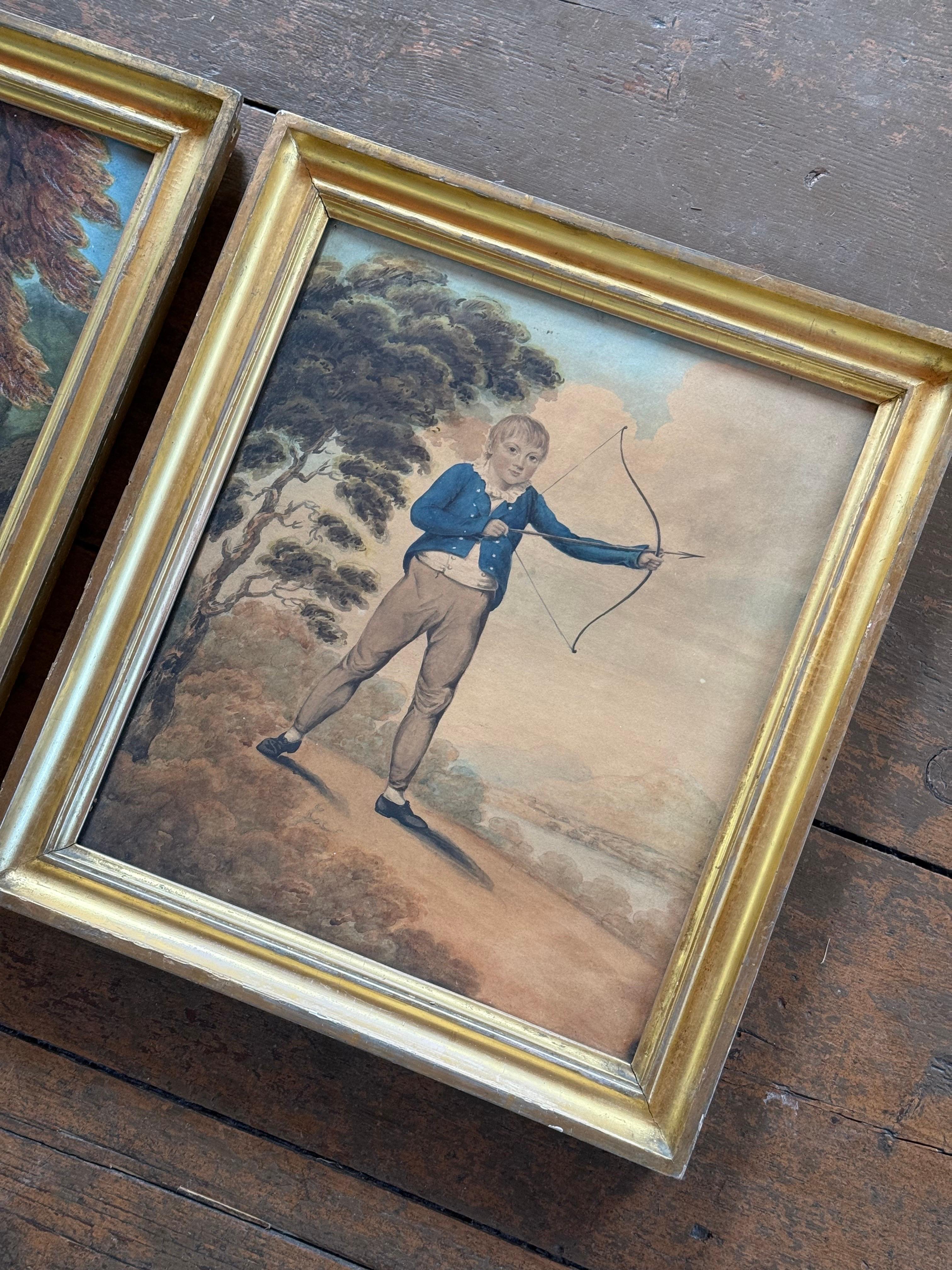 This is a lovely pair of watercolor paintings of two young children by British portrait painter James Ramsay (1789-1854).  One depicts a little girl clutching her kitten and the other is a boy with his bow and arrow. Watercolor on linen laid on