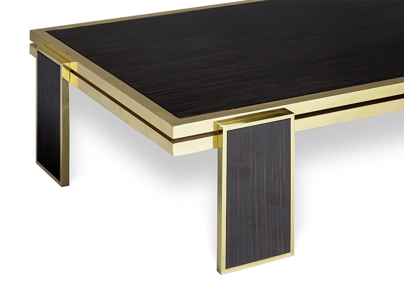James coffee table is a bold and exciting piece capable to add a touch of sophisticated elegance to any room. The geometric shapes and lines of this modern coffee table combined with the high gloss ebony wood and polished brass details create an