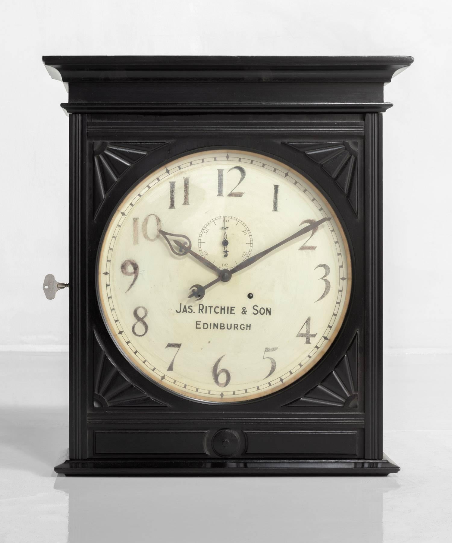 James Ritchie & Son Wall Clock, Scotland, circa 1900.

Beautifully patinated clock face set into an elegant wood wall mounting box with ornate detailing.

Measures: 25.25