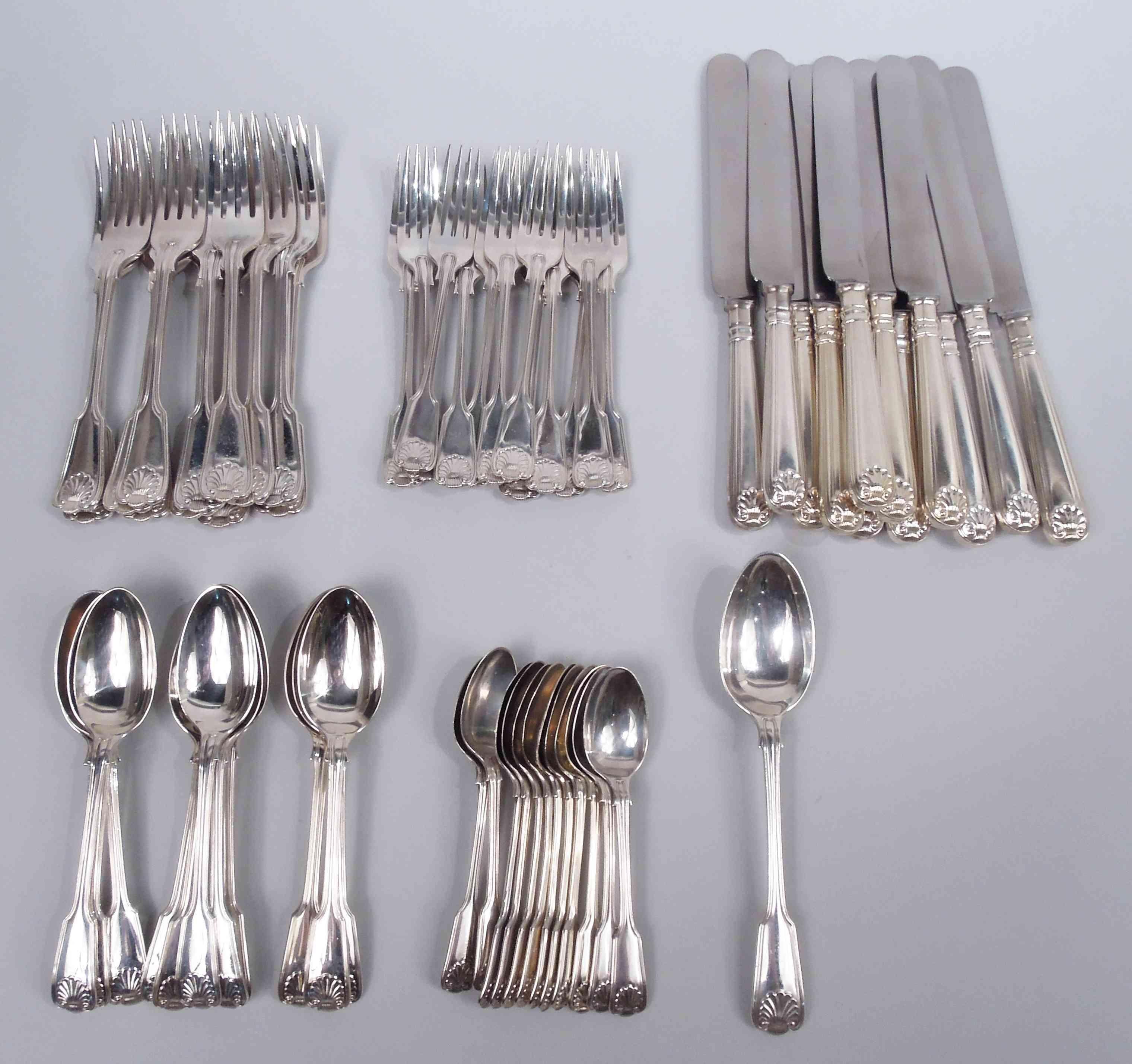 Fiddle Thread & Shell sterling silver dinner and lunch set. Made by James Robinson in London, 1980-2000. This set comprises 61 pieces (dimensions in inches):

Forks: 12 dinner forks (8 1/8) and 12 luncheon forks (7);

Spoons: 12 soup spoons (7 1/8),