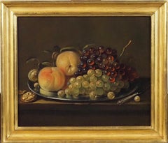 Still life of grapes, peaches and hazelnuts