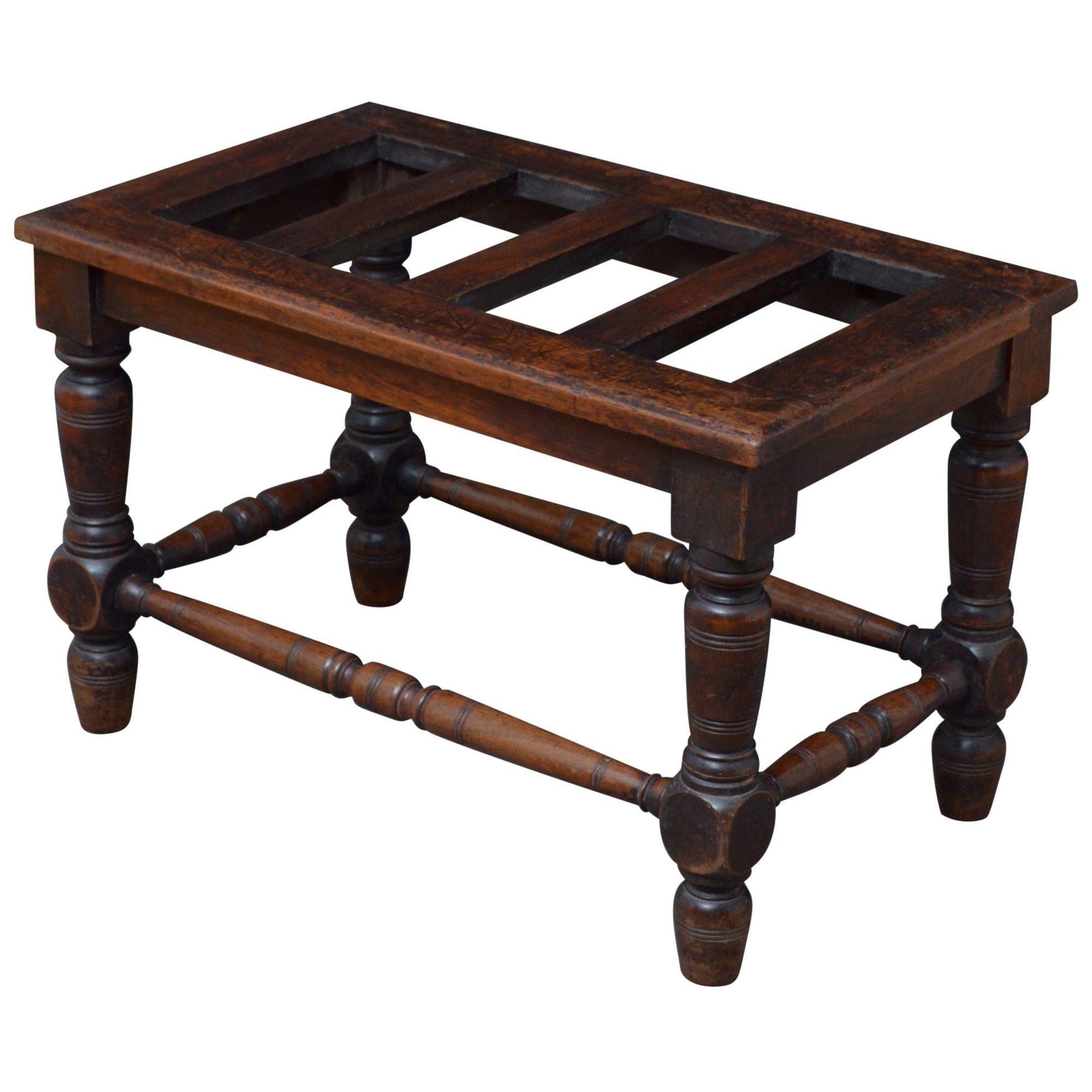 K0510 Substantial Jas Shoolbred solid mahogany luggage rack on turned and ringed legs united by turned and ringed stretcher. This antique luggage rack would make a good hall seat. Stamped Jas Shoolbred 5.
This piece retains original finish and