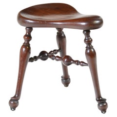 James Shoolbred walnut three legged cock-fighting stool