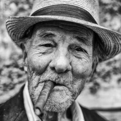 El Caballero - Framed portrait of an old cigar-smoking Cuban man with a smile