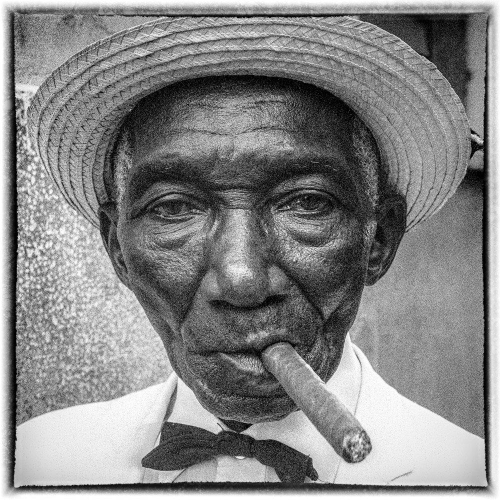 Portrait of Elvirio el Dandy.  An icon of Old Havana at the turn of the century.  His custom of wearing finery has spawned a whole generation of young “Dandies” who hang out on Havana’s streets.

The Spirit of the Revolution series documents the