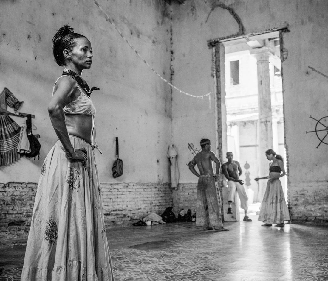 El Ensayo (the rehearsal) was taken during the Romerias de Mayo festival in Holguin Cuba. The troupe were preparing for a performance of Afro-Cuban dance and were using an abandoned colonial era building as a studio. I sat with the band most of the