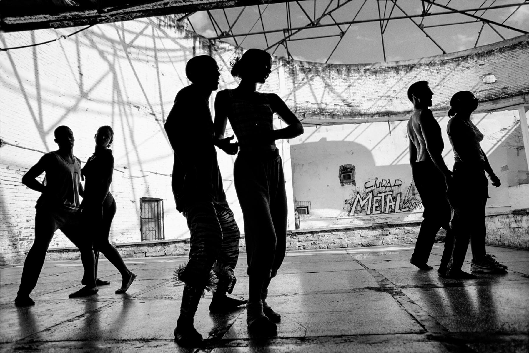 La telaraña or “spider’s web” was taken in a dance school in Santa Clara, Cuba. The dance symbolised the relationship between man and woman… the man flirting, the woman turning away whilst subtlely drawing him into her web.

James Sparshatt’s