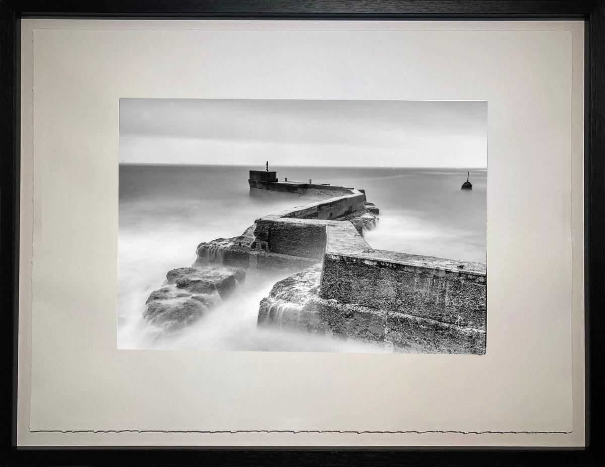 Rolling waves crashing against the breakwater in St Monan’s calmed by a long exposure after dark.

James Sparshatt’s black and white landscapes have an ethereal beauty.  They are moments when the natural form of topography is given magic by the