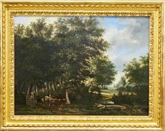 Herding cattle through a wooded river landscape