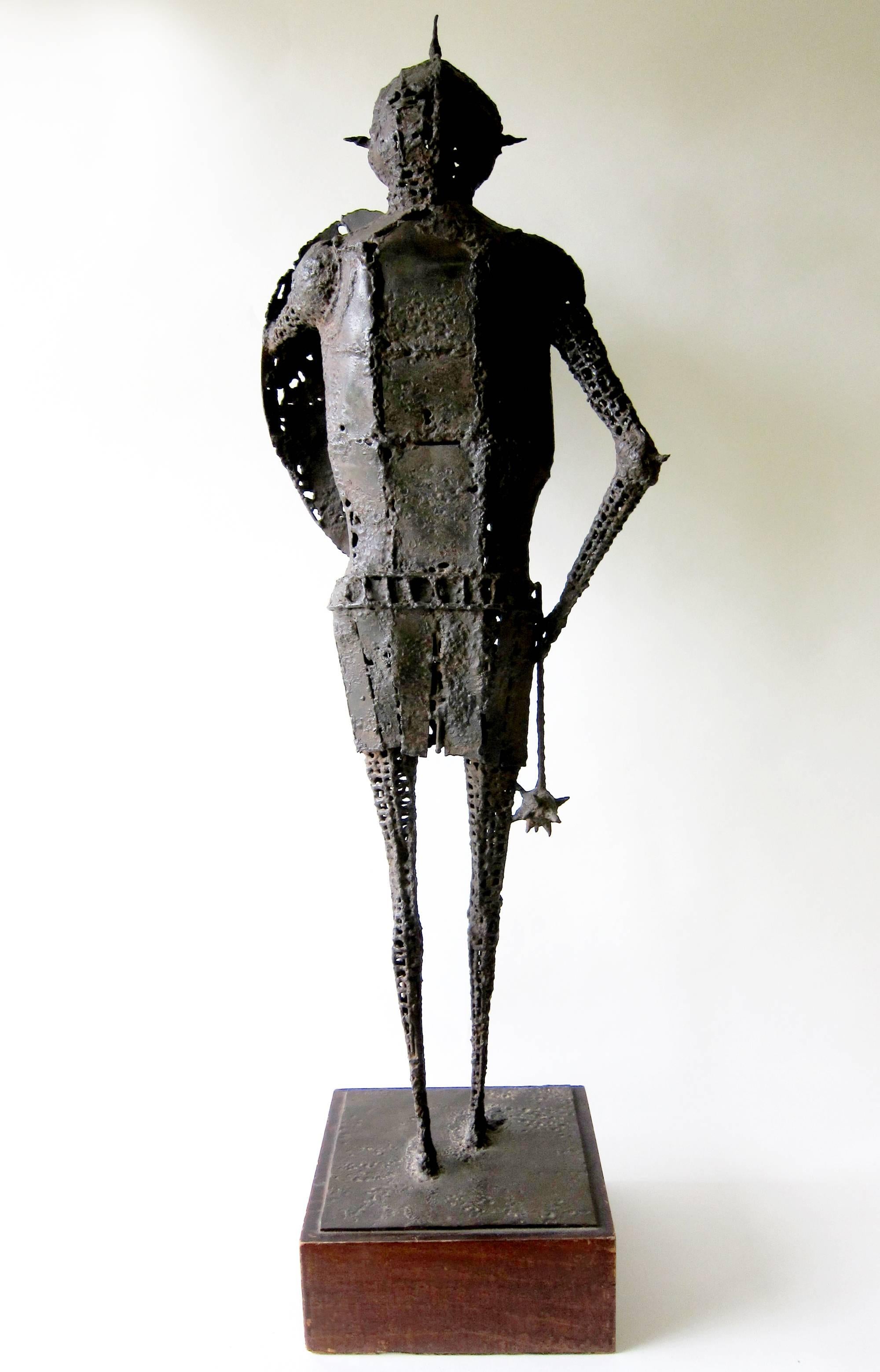 Unique and intricate medieval knight sculpture with flail created by listed artist James Wines of New York. Sculpture was made earlier in his career and dates from the 1950's. Its overall measurement is 40