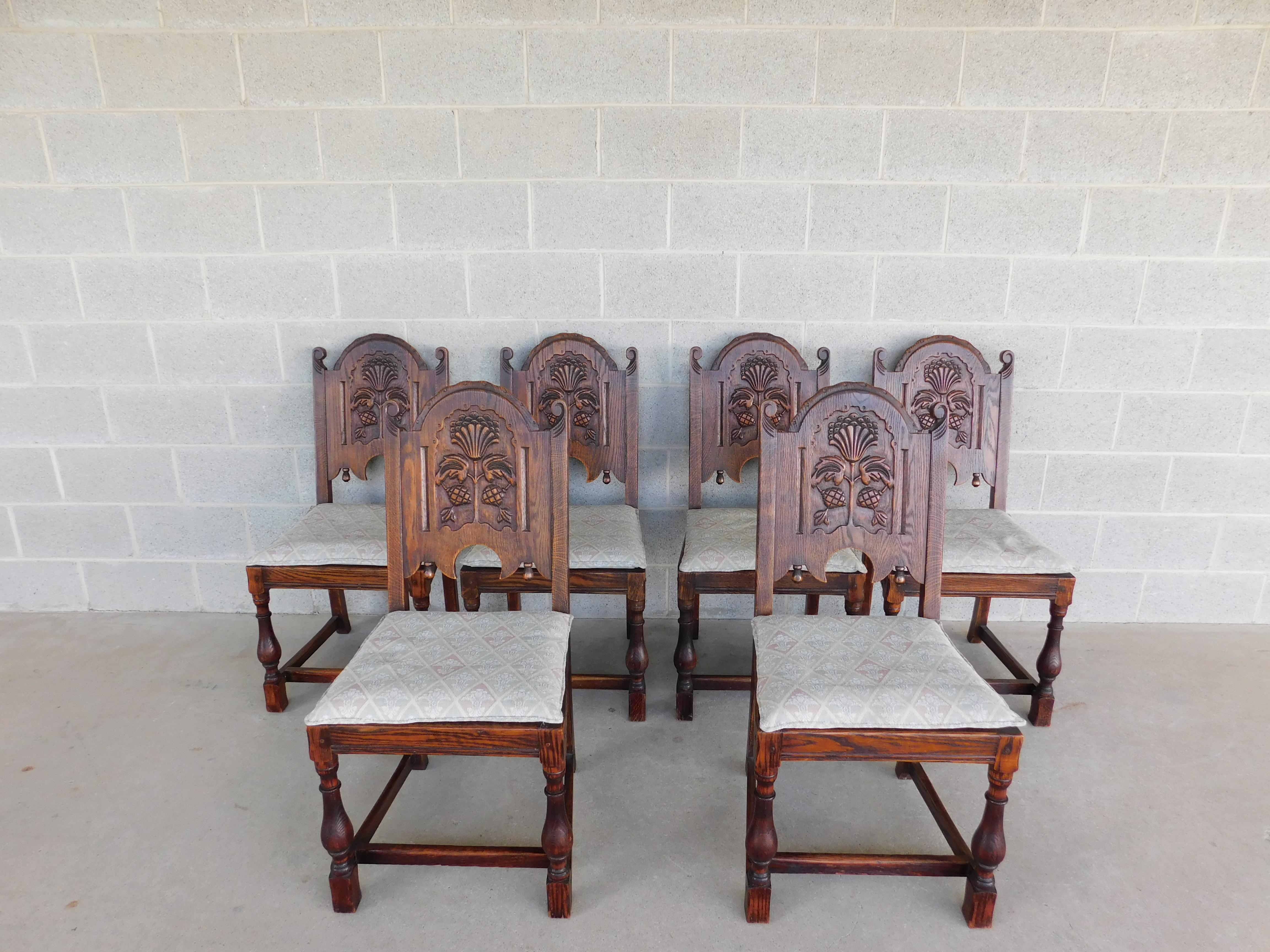 Set of 6 Side Chairs, Solid Oak Stretcher Base with Turned Legs, Flemished Carved Backrest. Upholstery is updated approx 30 years old in clean condition. 
Back Height 38.5