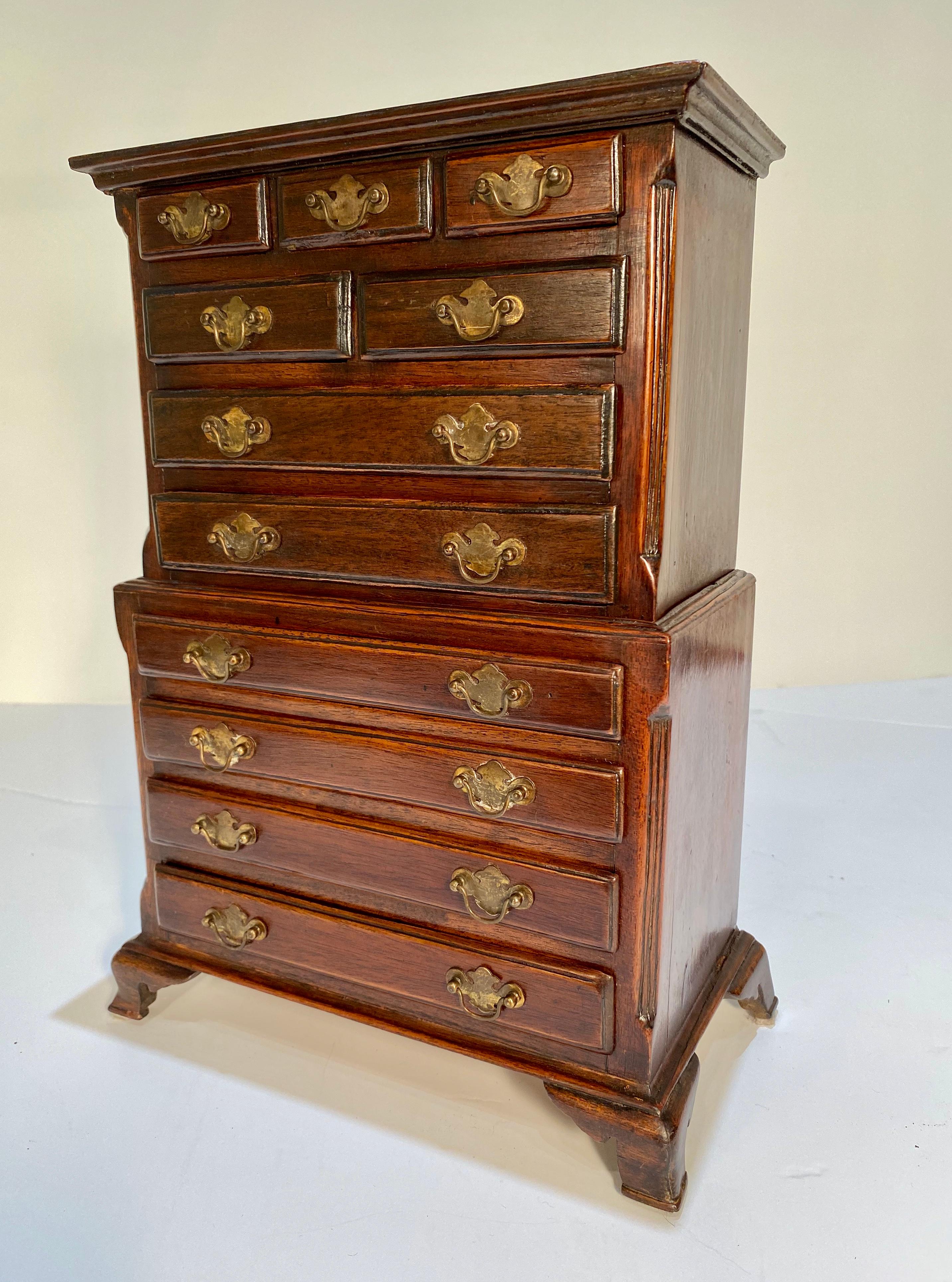Wonderful George III Style mahogany hand dovetail two part sampler chest on chest made in Jamaica. This Chippendale style chest on chest was made in the early 20th century. The sample chest is stamped in two places 