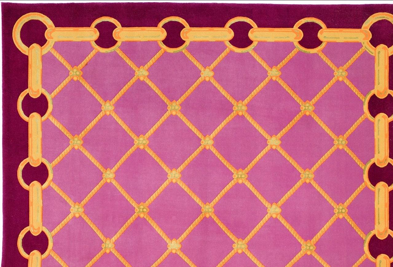 Jmie Drake - Tapis 'Chain and Rope - Purple' 6' x 9' (Chaîne et corde - violet)
Matière : 100% laine

Voici Via Como, le summum des tapis noués à la main haut de gamme. Réputés pour leur qualité artistique inégalée et leur exclusivité, les tapis Via