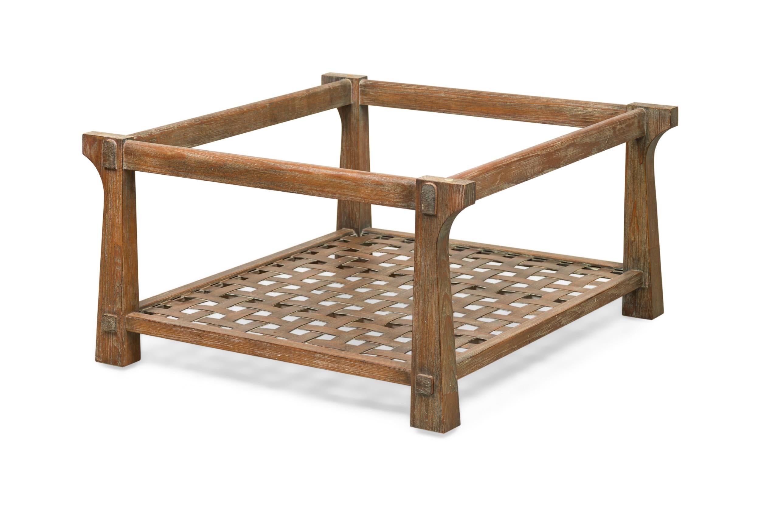 Contemporary American square form cerused wood table frame with distinctly shaped legs tapering toward the top and a caned lower shelf. (NO GLASS TOP: can be made upon request) (JAMIE HERZLINGER)
 

 Frame only, missing top.
