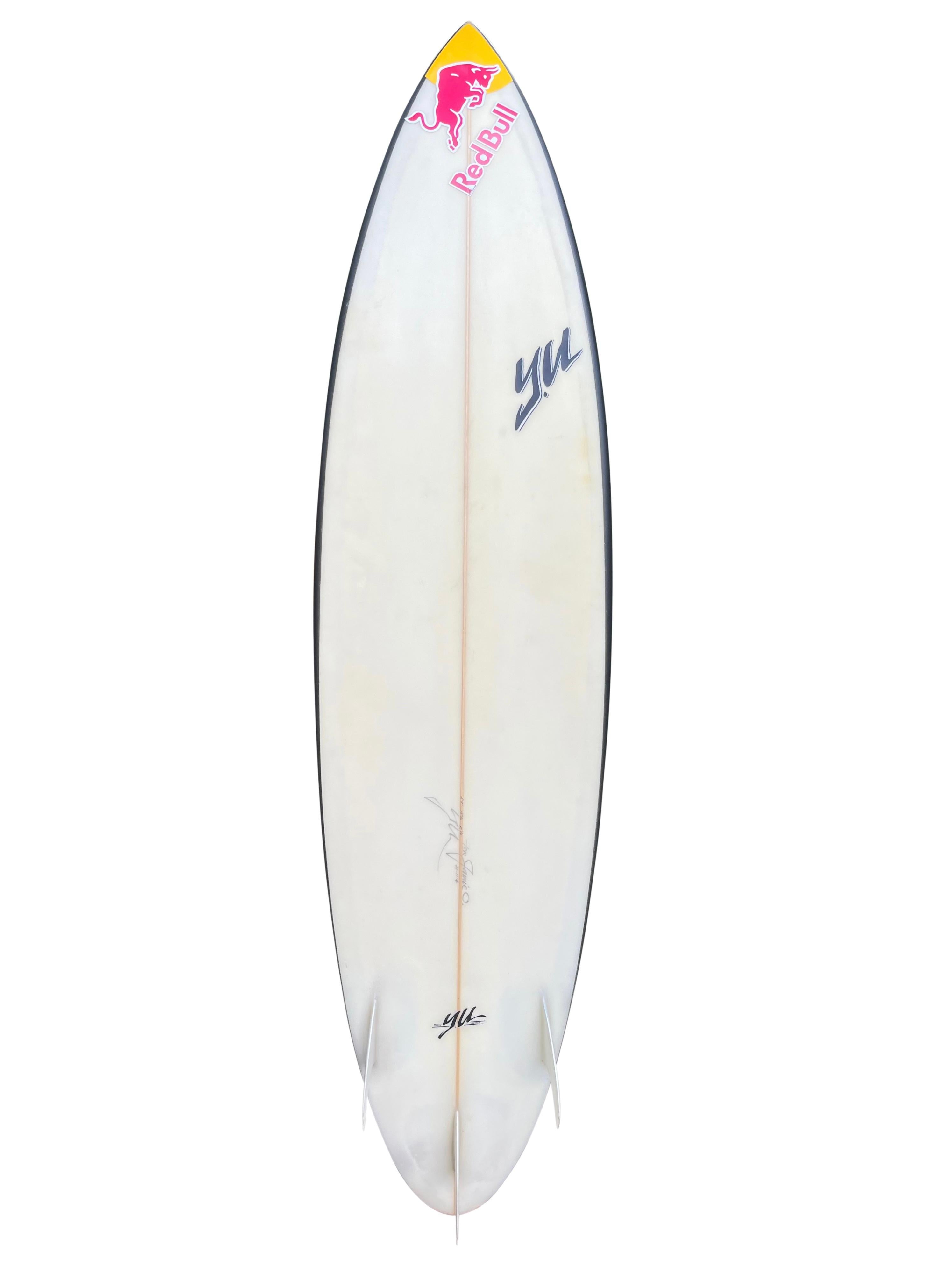 Jamie O’Brien’s personal Pipeline surfboard made by Y.U (Yoshinori Ueda). Features O’Brien’s signature pink airbrush-fade with jet black rails. Made specifically for riding barrels at iconic Hawaiian surf break, Banzai Pipeline. Round pintail shape