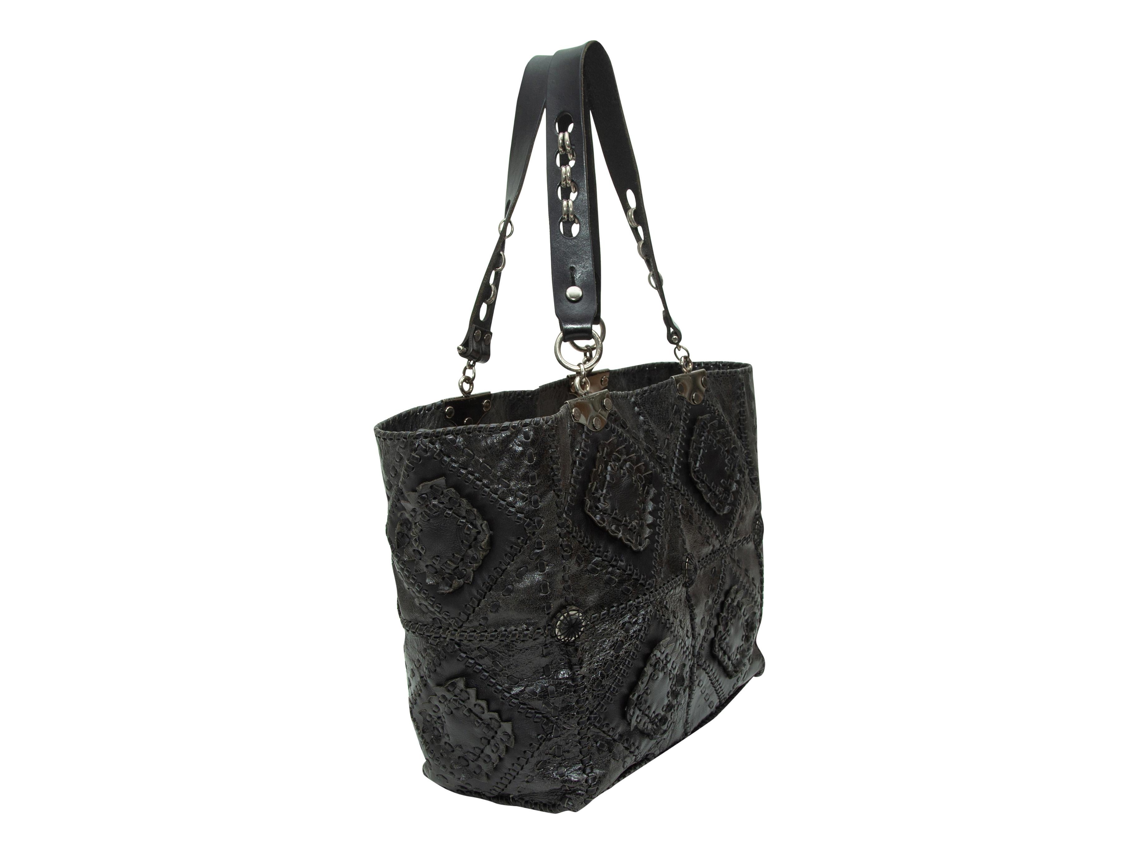 Product details: Black patchwork leather tote bag by Jamin Puech. Silver-tone hardware. Interior zip pocket. Dual handles. Woven detailing throughout. 17