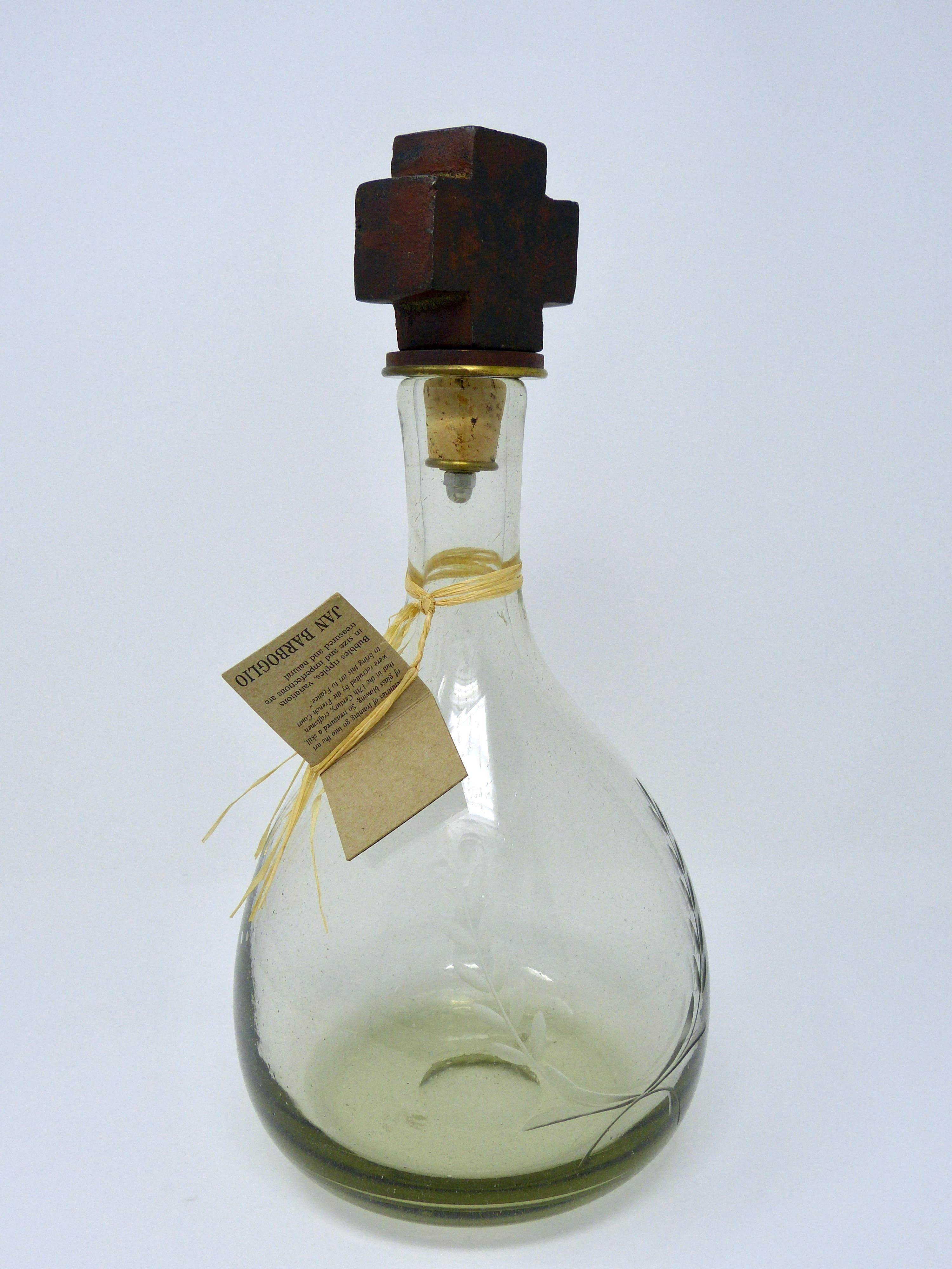 Blown glass decanter with forged iron cross topper 
Made by Jan Barboglio
Mexico.
 