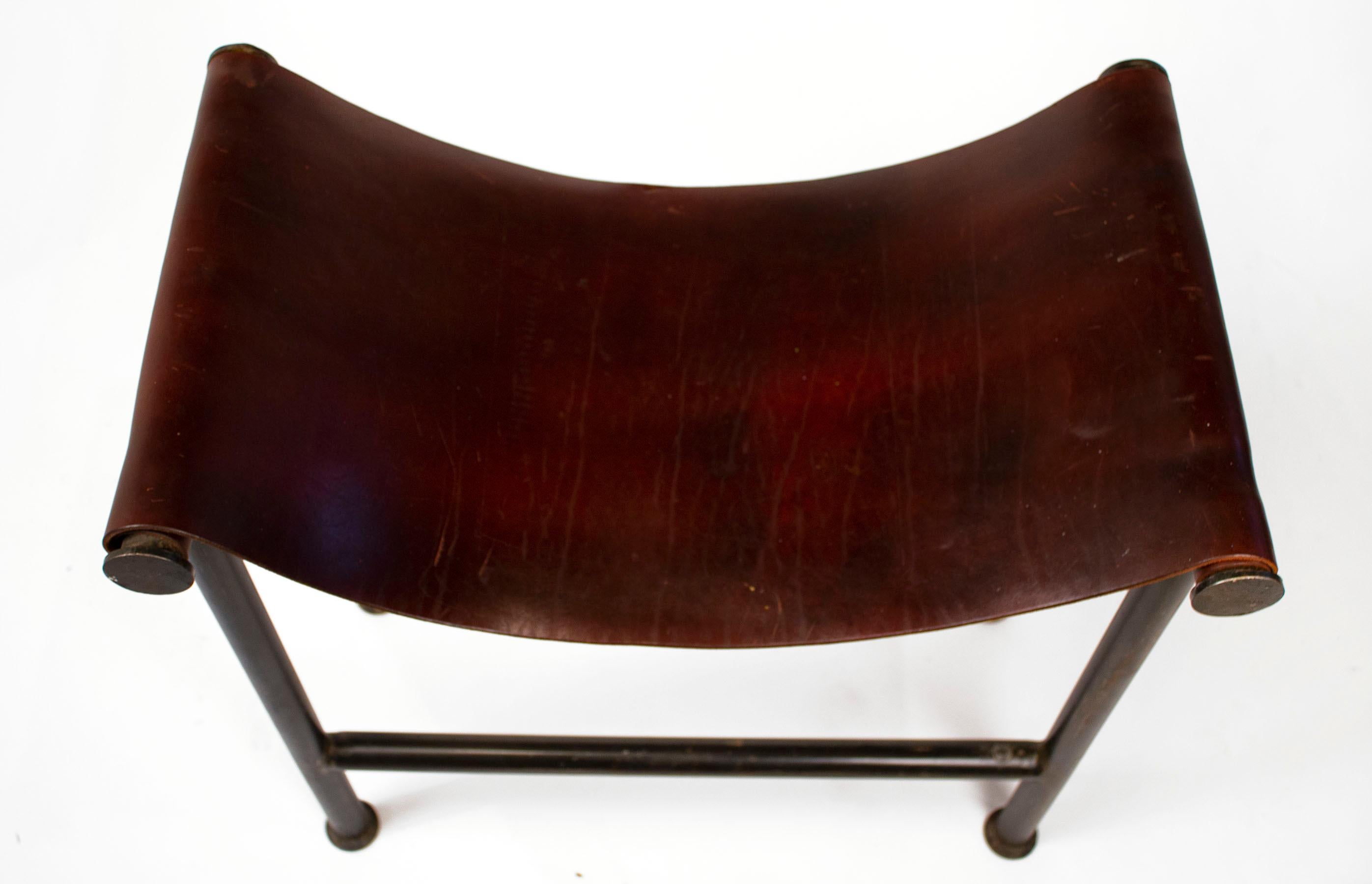 Steel and leather stool by Texas designer Jan Barboglio.
Thick saddle leather and patinated steel. Signed with her hallmark.