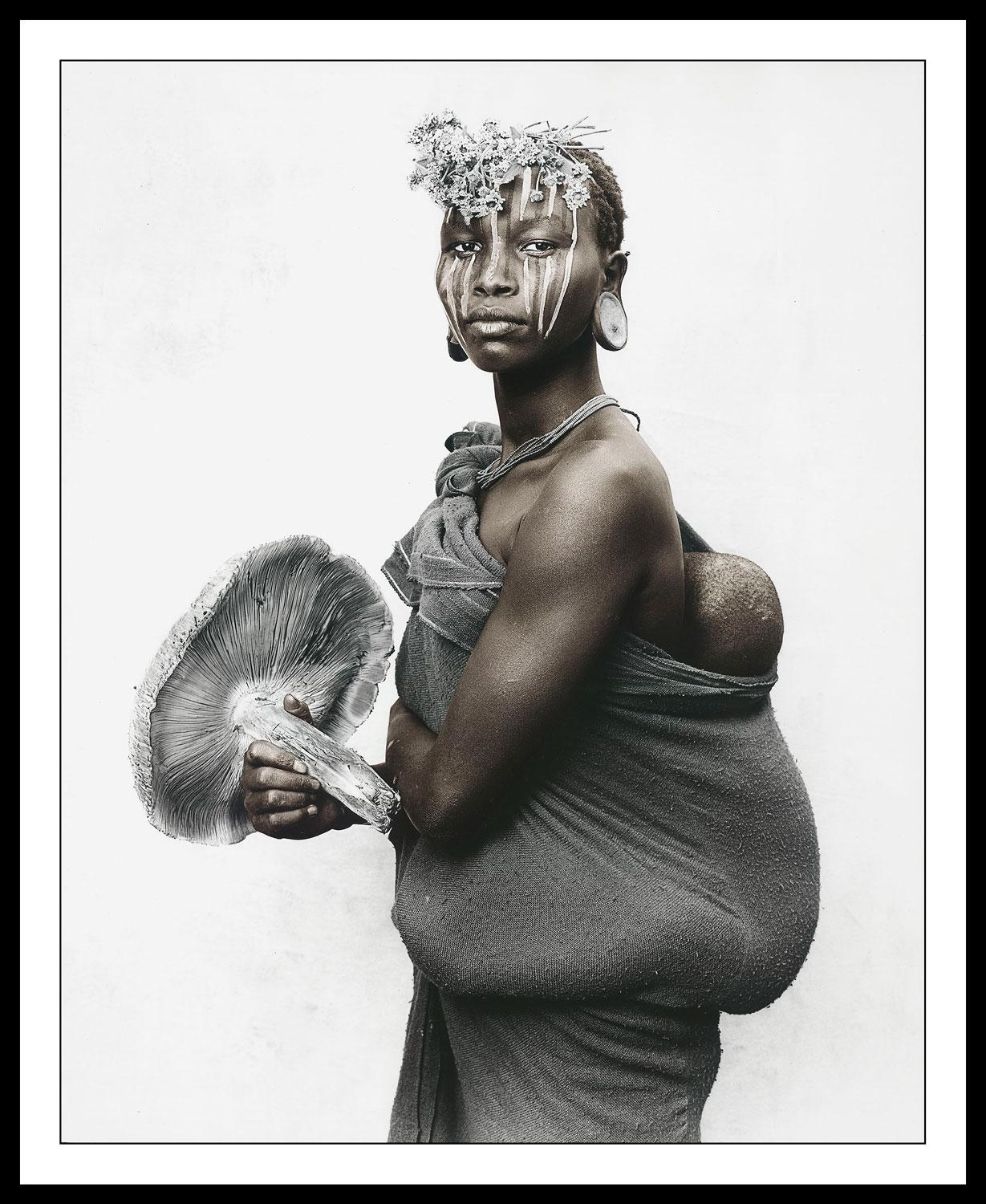 Mother with mushroom, Suri tribe, Ethiopia - Gray Portrait Photograph by Jan C. Schlegel