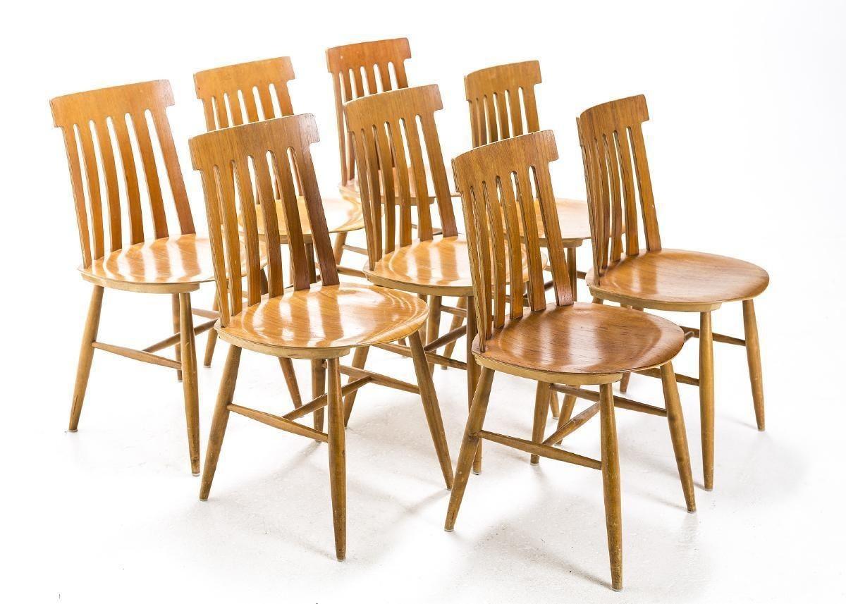 Set of eight matching Scandinavian chairs designed in the 1960s by Jan Hallberg for the Swedish house of Fabrique Tallåsen. These mid century beauties are crafted of Scandinavian beech with a teak seat and are in excellent vintage condition. Whether
