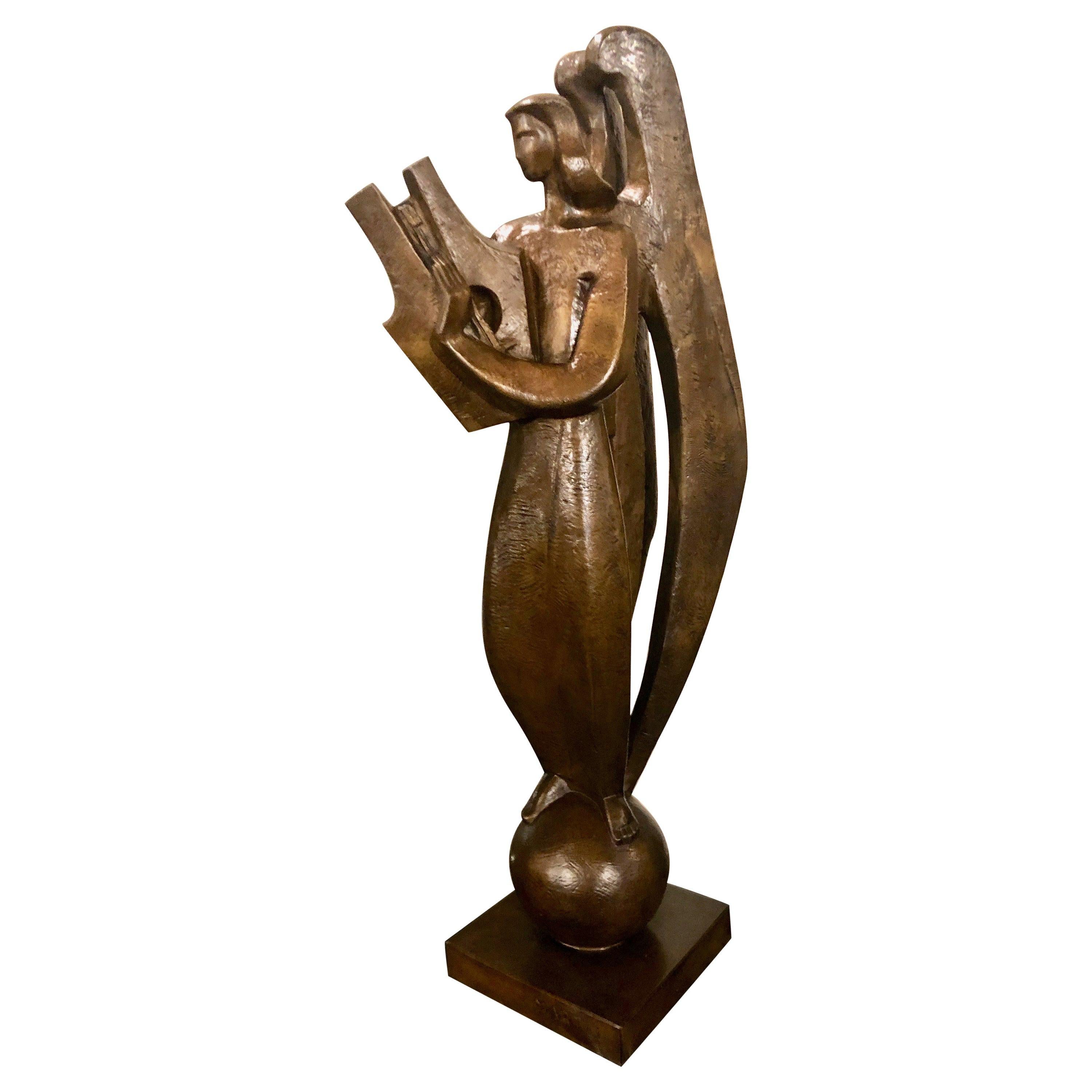 Original bronze by Jan and Joel Martel. Image of a stylized cubist Angel playing a harp.. Rare and famous figurative bronze made by Susse Frères foundry cast posthumously from the original with permission of the family in 2002. Signed: 