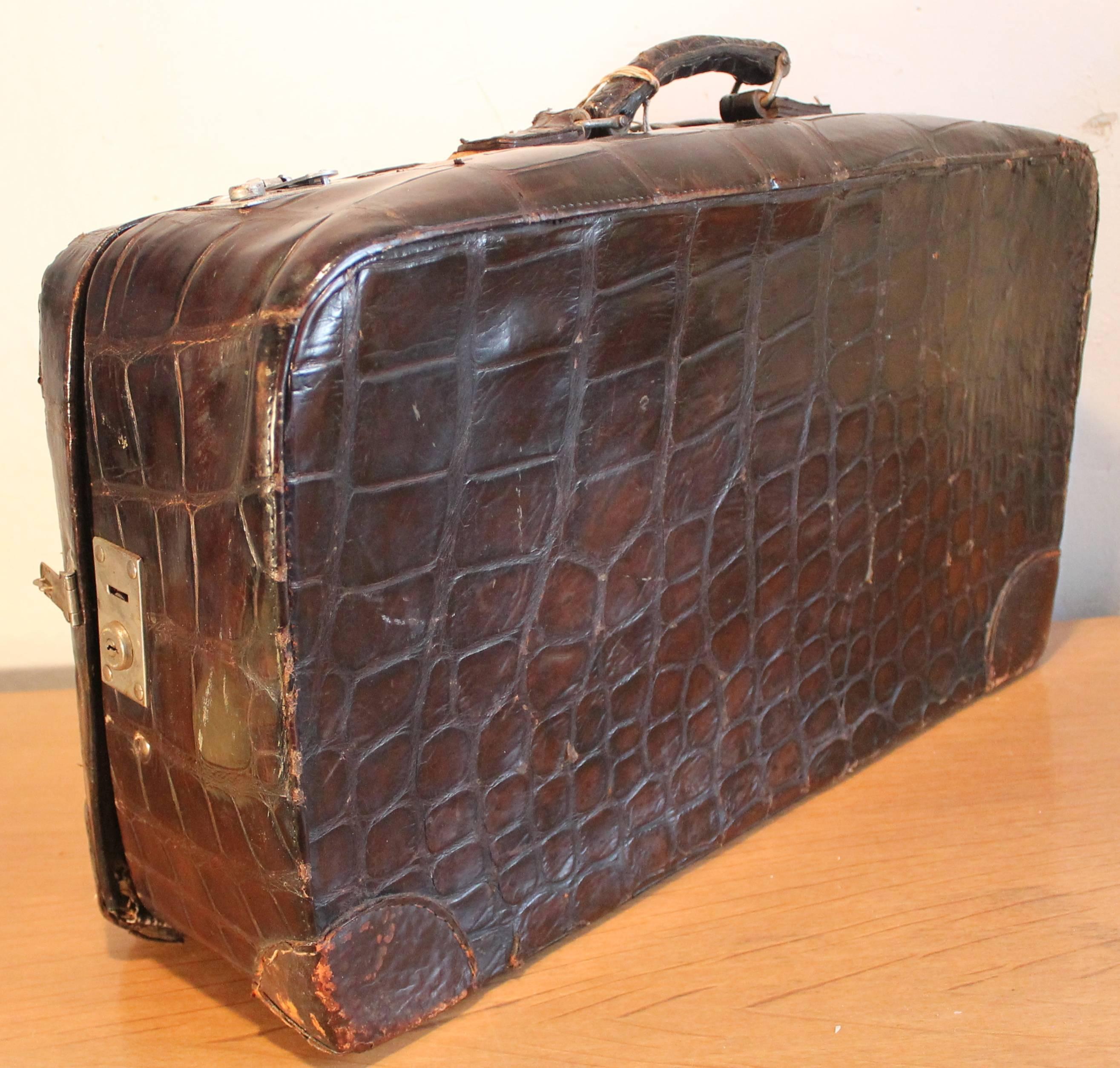 A beautiful high quality deluxe brown/black suitcase, much travelled by the acclaimed and famous Polish/American opera and film star Jan Kiepura. Note in the last photo the impression of the J K initials.