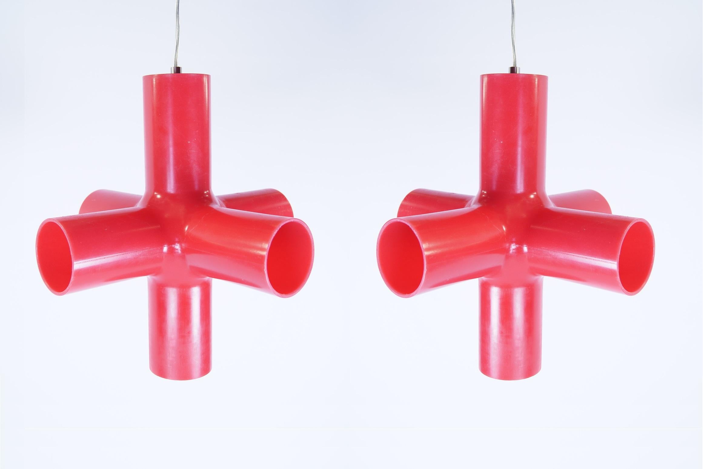 2 x crosslight red. Lamps are in good condition.

The Crosslight is a design for Dark by a Dutch design duo: Jan Melis & Ben Oostrum. The Crosslight is a plastic cross with a light source in the middle, the open sides of the cross give a very