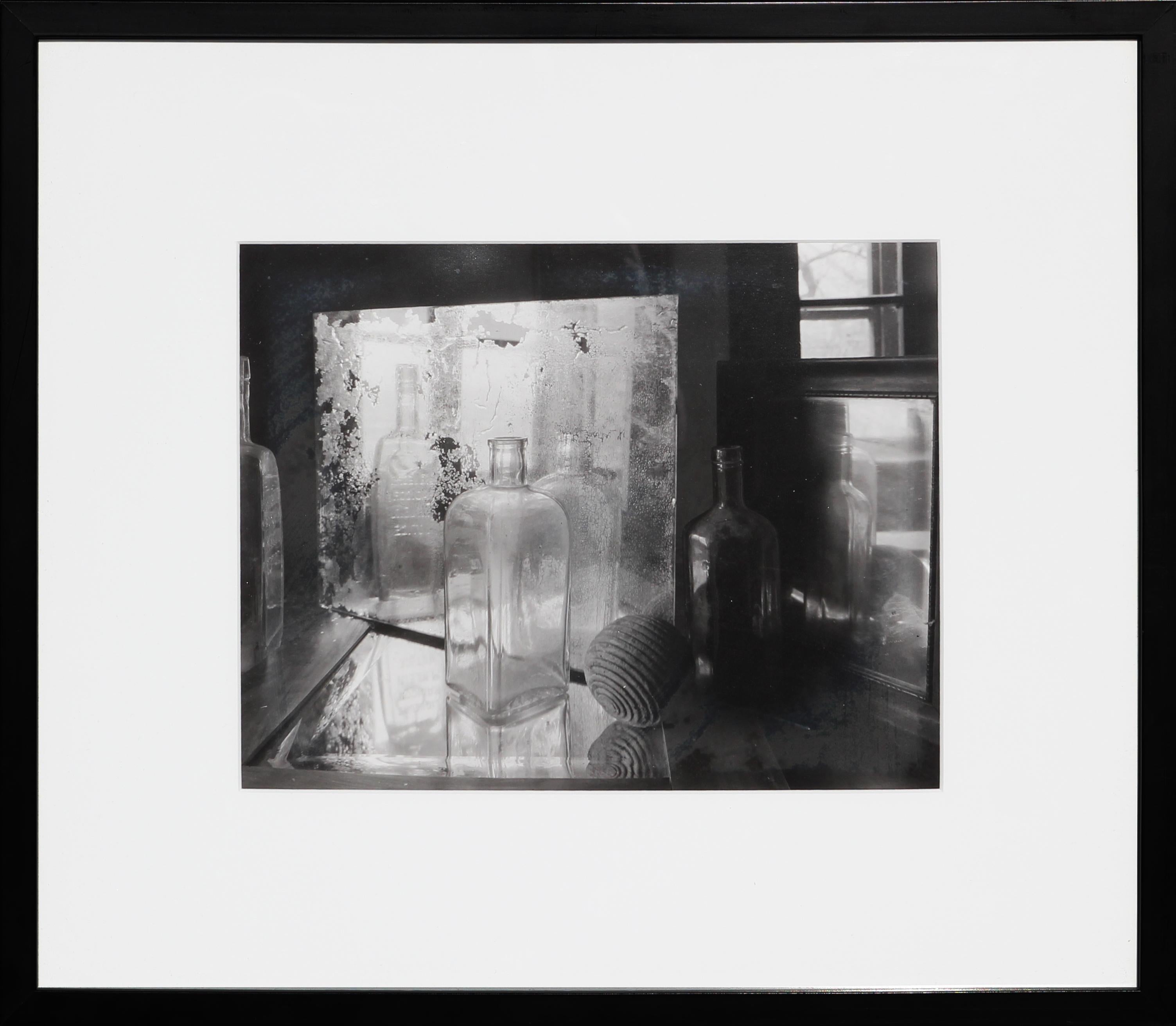 Jan Reich Black and White Photograph - "Still Life III" Black & White Silver Gelatin Photograph of Bottles and Mirrors