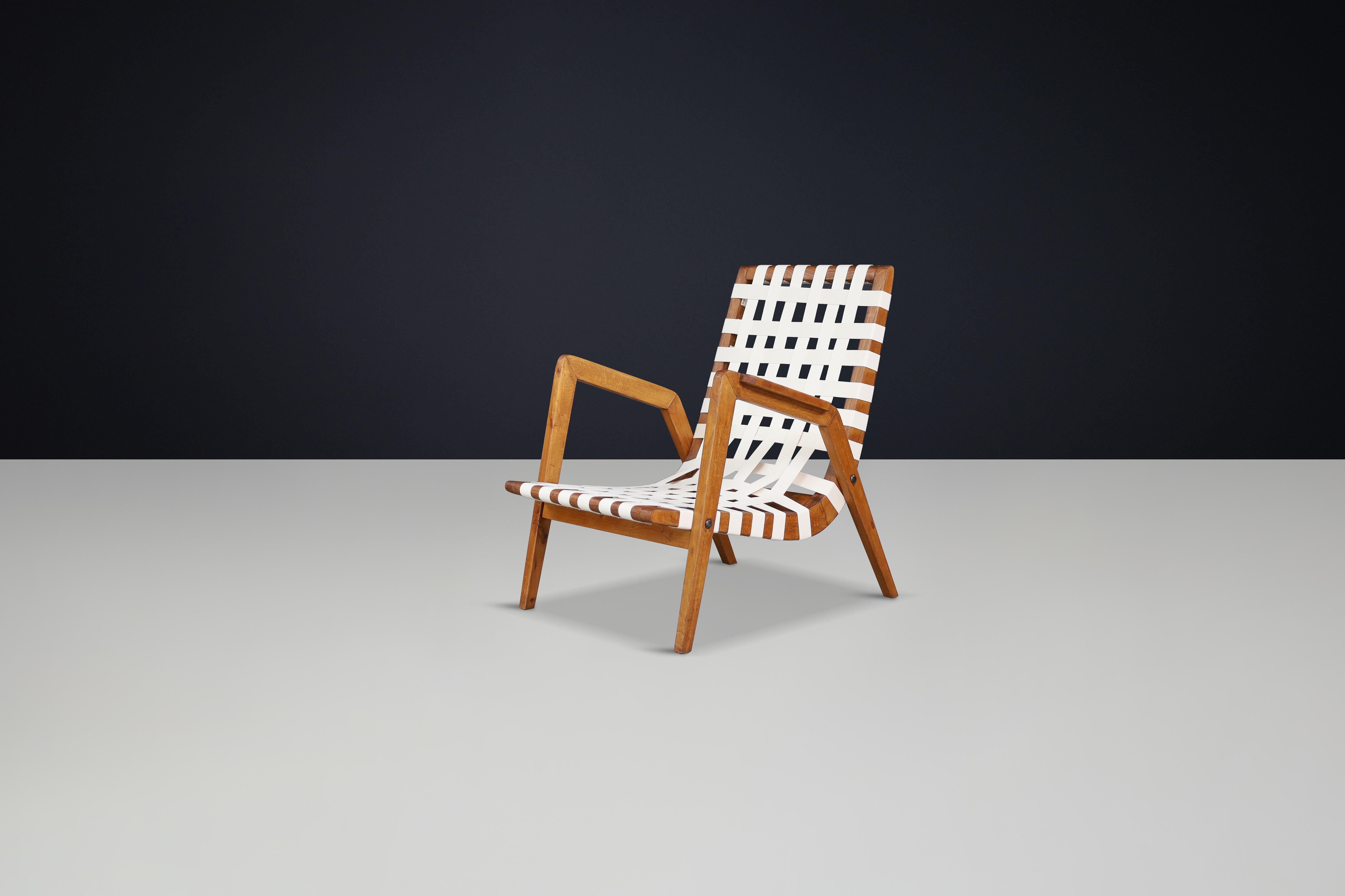 Jan Vaněk Easy Chair in Oak and Canvas, Czechoslovakia, 1930s

A striking and iconic example of early European modernism, this easy chair by Jan Vaněk—an influential figure in Czechoslovakian design—beautifully captures the functional elegance of